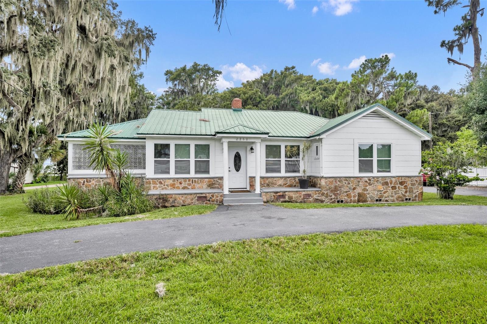 $456 A SQUARE FOOT? OR IS IT $226 A SQUARE FOOT? Yes, the FRONT property is at 1,993 square feet. But if you add the BACK property consisting of a 2-story duplex with the top property being 1,008 square feet 2 bed 2 bath and the bottom being the same at 1,008 square feet 2 bed 2 bath you get a grand total of 4,009 square feet! All remodeled with lake access and a boat house for a fisherman's dream. Why not live in the front and have the duplex rented out. Fish while you reel in passive income.