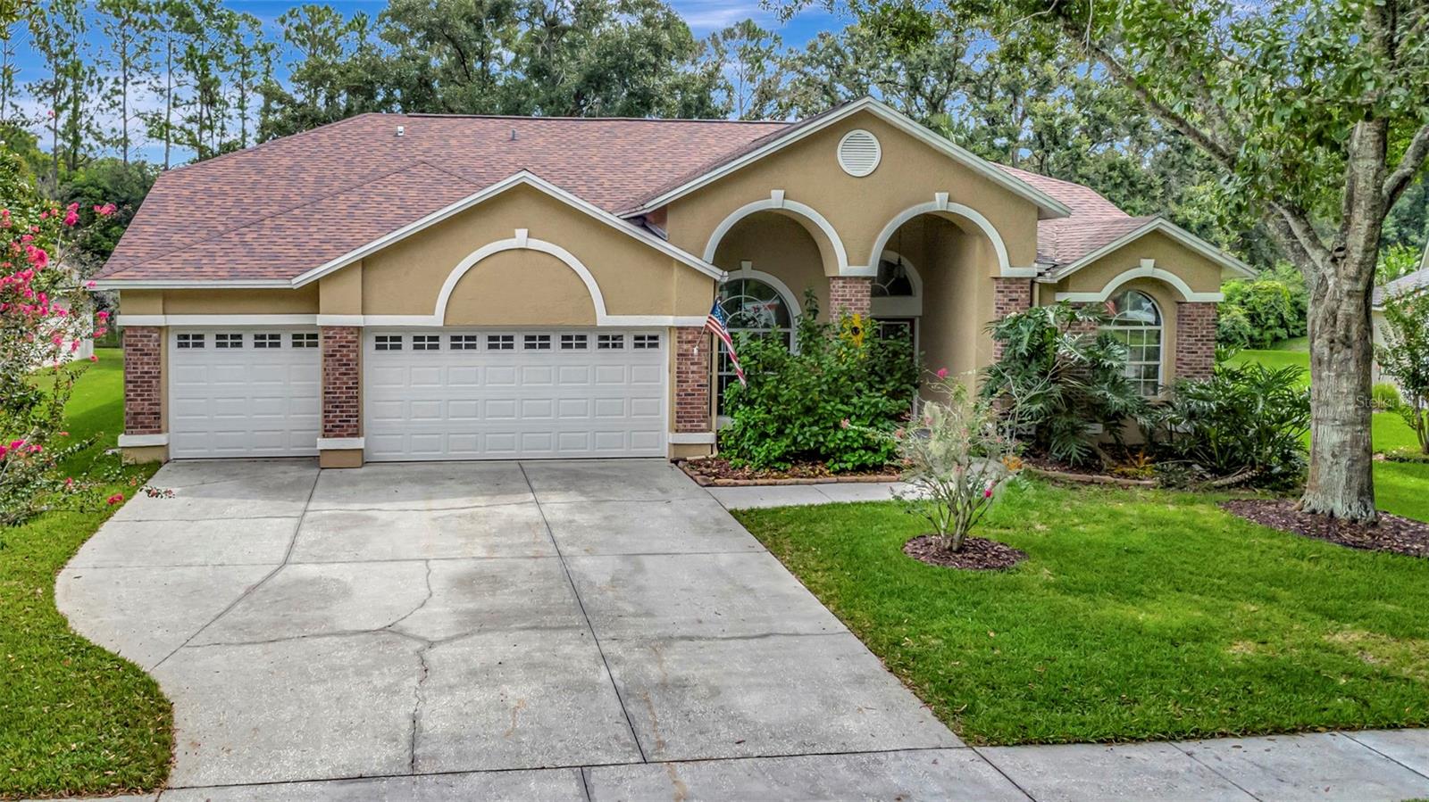 Welcome to this beautifully maintained 4-bedroom, 3-bathroom home in the desirable Belle Glen neighborhood. Nestled on a serene, wooded conservation lot with a peaceful pond view, this residence offers both privacy and natural beauty. As you enter the double door entry, notice the open floor plan that is highlighted by functional spaces including a formal dining area adjacent to a formal living room that is currently used as a fantastic library! Glass doors highlight the dedicated home office, perfect for working from home or managing daily tasks. This room can easily be converted into a fifth bedroom as well! The split floor plan is ideal for privacy and the primary sweet features tall ceilings, his and hers closets and a spa-like bathroom complete with large glass shower and a garden tub for soaking.
The kitchen and breakfast dining area overlook the heart of the home, the great room. Featuring a wood-burning fireplace and copious space for family activities or evening soirees this magnificent area opens to a screened pool and outdoor living space, creating an inviting retreat for relaxation and entertaining. Steps from the great room are two additional bedrooms that share a bath as well as a private bedroom that overlooks the pond to the rear of the home offering peaceful vistas.
Practical updates to this home provide peace of mind, including a roof and HVAC (including duct work) replaced just 5 years ago, updated engineered wood flooring throughout (2020) fresh exterior paint in 2023, and a brand-new wood fence. A spacious three-car garage ensures plenty of room for parking and storage. With its blend of functional layout and scenic surroundings, this home is the perfect combination of comfort and lifestyle.
Belle Glen is a beautiful community with mature, tree-lined streets, a lovely park that includes gazebos, a playground and a basketball court. Centrally located between Keystone, Carrollwood, and Odessa this location has easy access to the Veterans Expressway, Tampa International Airport, hospitals, shopping, dining, Bucs Stadium, Busch Gardens, and local beaches. Belle Glen is situation within Hillsborough County’s top rated school district including Northwest Elementary (just a short walk away) as well as Steinbrenner High School.