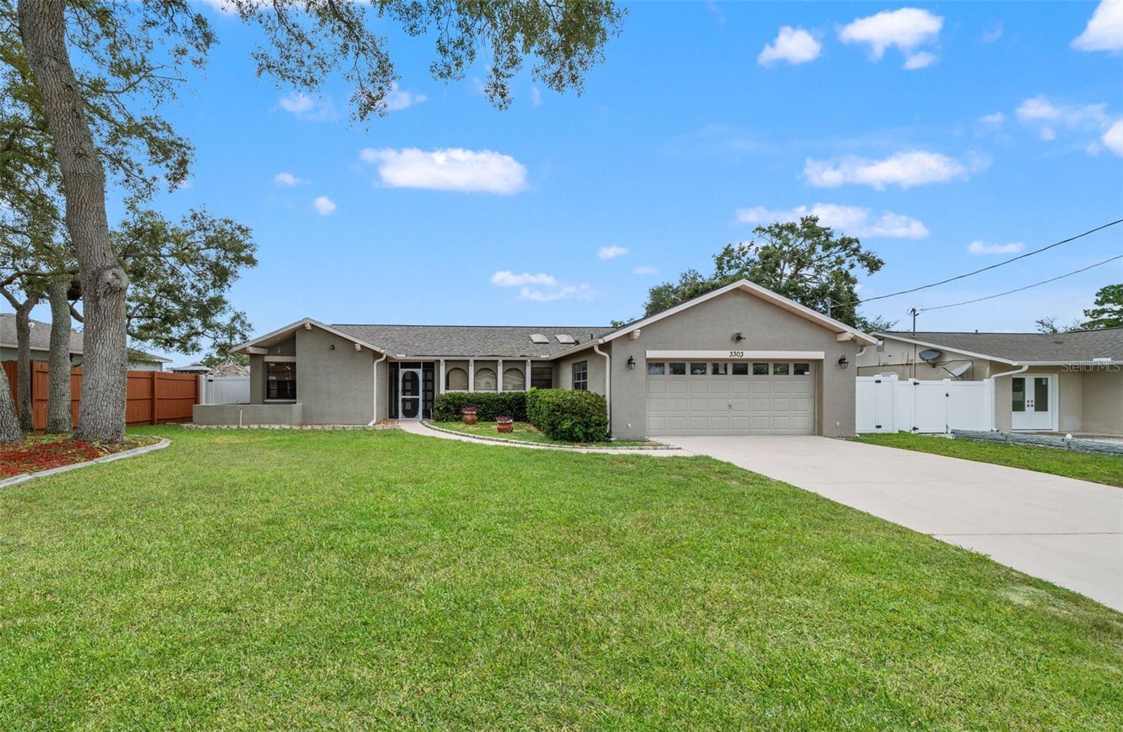 One or more photo(s) has been virtually staged. This beautifully maintained 3-bedroom, 2-bathroom pool home offers the perfect blend of comfort, functionality, and freedom—with no HOA or CDD fees. Major updates include a brand-new A/C for year-round comfort and a roof replaced in 2022, giving you peace of mind for years to come.
Step inside to find a spacious open layout featuring stylish flooring, two skylights that fill the home with natural light, a bright and airy living area, and a well-appointed kitchen with ample counter space, stainless steel appliances, and a breakfast bar perfect for casual dining.
The primary suite offers plenty of natural light, direct pool access, and an updated en-suite bathroom with a walk-in shower. The additional bedrooms are generously sized, ideal for family, guests, or a home office.
Step outside to your own private retreat—a sparkling, screen-enclosed pool surrounded by a spacious patio. The property is completely fenced, providing privacy and security for pets, play, or gatherings.
Don’t miss your chance to own this move-in ready pool home—schedule your showing today!