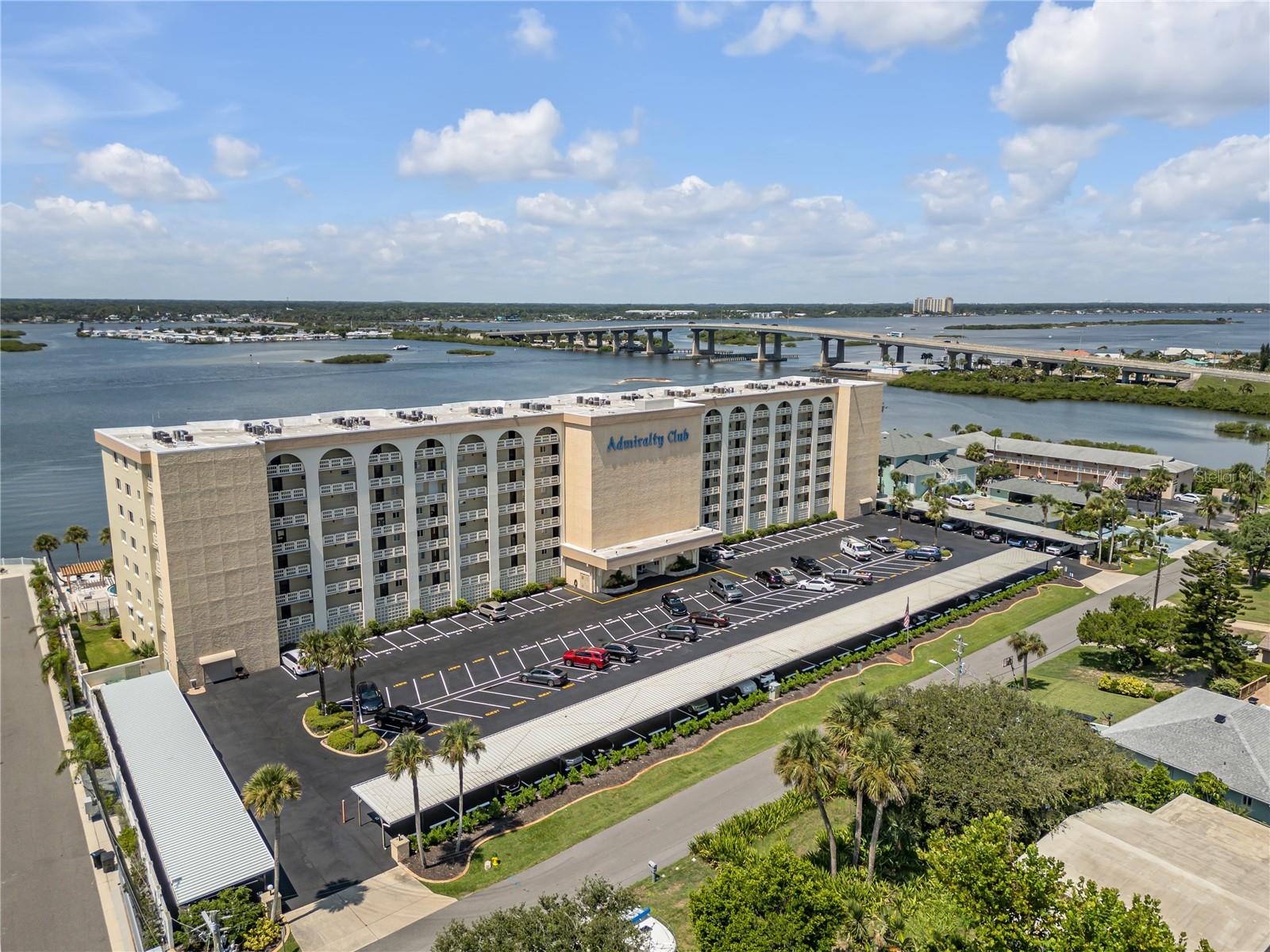 Extraordinarily RARE opportunity to own this beautiful condo with million-dollar views from this DIRECT RIVERFRONT condo in one of the most sought-after buildings in the area. Bright and spacious, this 2nd-floor, 3 Bed/2 Bath unit was lovingly renovated with luxury vinyl plank flooring throughout, sparkling cabinetry, granite countertops, appliances, lighting, windows, slider, and two beautifully updated bathrooms. Enjoy open-concept dining and living space, or retreat to your primary bedroom with stunning river views and en suite bathroom. Split bedrooms and guest bath offer privacy, while an ADA lift assist can be removed or purchased separately as needed in the guest bedroom. MOVE RIGHT IN and start enjoying carefree, beachside living! Watch gorgeous sunsets from your private balcony overlooking the Intracoastal Waterway, or walk, bike, or drive a few blocks to the beach to enjoy the surf or watch the rocket launches. Relax and let the dolphins, yachts, marine birds, and sunsets entertain you. The Admiralty Club is on a quiet end street, yet close to restaurants and shopping. Amenities include 1 deeded, covered parking space, storage cage, large riverfront heated pool, gazebo, BBQs, sauna, kayak/SUP floating dock, and riverfront party/community room for gatherings, happy hour get-togethers, and so much more. Also included is a daily onsite manager, coin-operated laundry on each floor, and bicycle storage. All state inspections have been passed, reserves are at 100 Percent, and have exceeded state requirements, which will add to your peace of mind—so don't wait on this one. HURRY and call now to schedule your showing before the "sun sets" on your opportunity to own your very own slice of paradise.