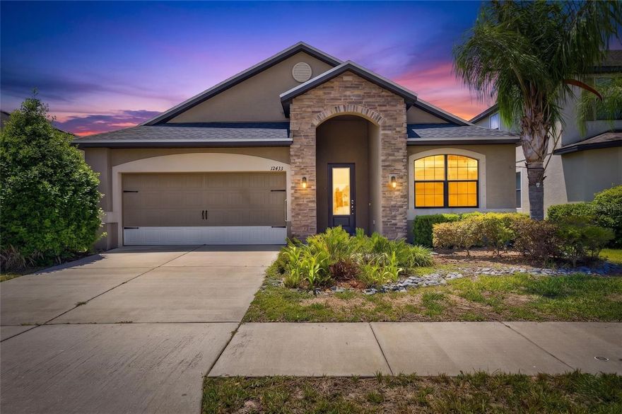 Located in the highly desirable Ballentrae community, this beautifully maintained LGI Homes Sanibel model offers the perfect blend of space, style, and value at one of the best prices currently available in the neighborhood. Built in 2016 with solid block construction, this 3-bedroom, 2-bath, 2-car garage home features 1,892 SqFt of bright and welcoming living space with high ceilings, elegant tray ceilings in the family room, and a true formal dining room. The open-concept layout is enhanced with upgraded wood laminate flooring throughout the main living areas, flush-mount LED lighting, and an abundance of natural light that creates a warm and inviting atmosphere from the moment you walk in. The chef-inspired kitchen is designed to impress with granite countertops, real wood staggered cabinetry, stainless steel appliances, a large center island with sink, and ample cabinet and prep space ideal for entertaining and everyday living. The oversized owner’s suite is a true retreat featuring private access to the extended screened lanai, a spacious ensuite bathroom with dual vanities, soaking tub, walk-in shower, and a large walk-in closet. Additional features include hurricane shutters stored in the garage, spacious secondary bedrooms, and a covered lanai perfect for relaxing outdoors year-round. Ballentrae offers an incredibly low HOA of only $133 per year with amenities including a community pool, playground, and clubhouse. Conveniently located just minutes from Publix, Starbucks, Sam’s Club, Tractor Supply, St. Joseph’s Hospital-South, shopping, dining, and major commuter routes including US-301 and I-75 for an easy drive to Downtown Tampa, MacDill AFB, Tampa International Airport, and Florida’s world-famous Gulf Coast beaches. Homes with this combination of condition, upgrades, location, and value are becoming increasingly hard to find in Riverview. Don’t miss your opportunity to own this move-in ready gem before someone else does.