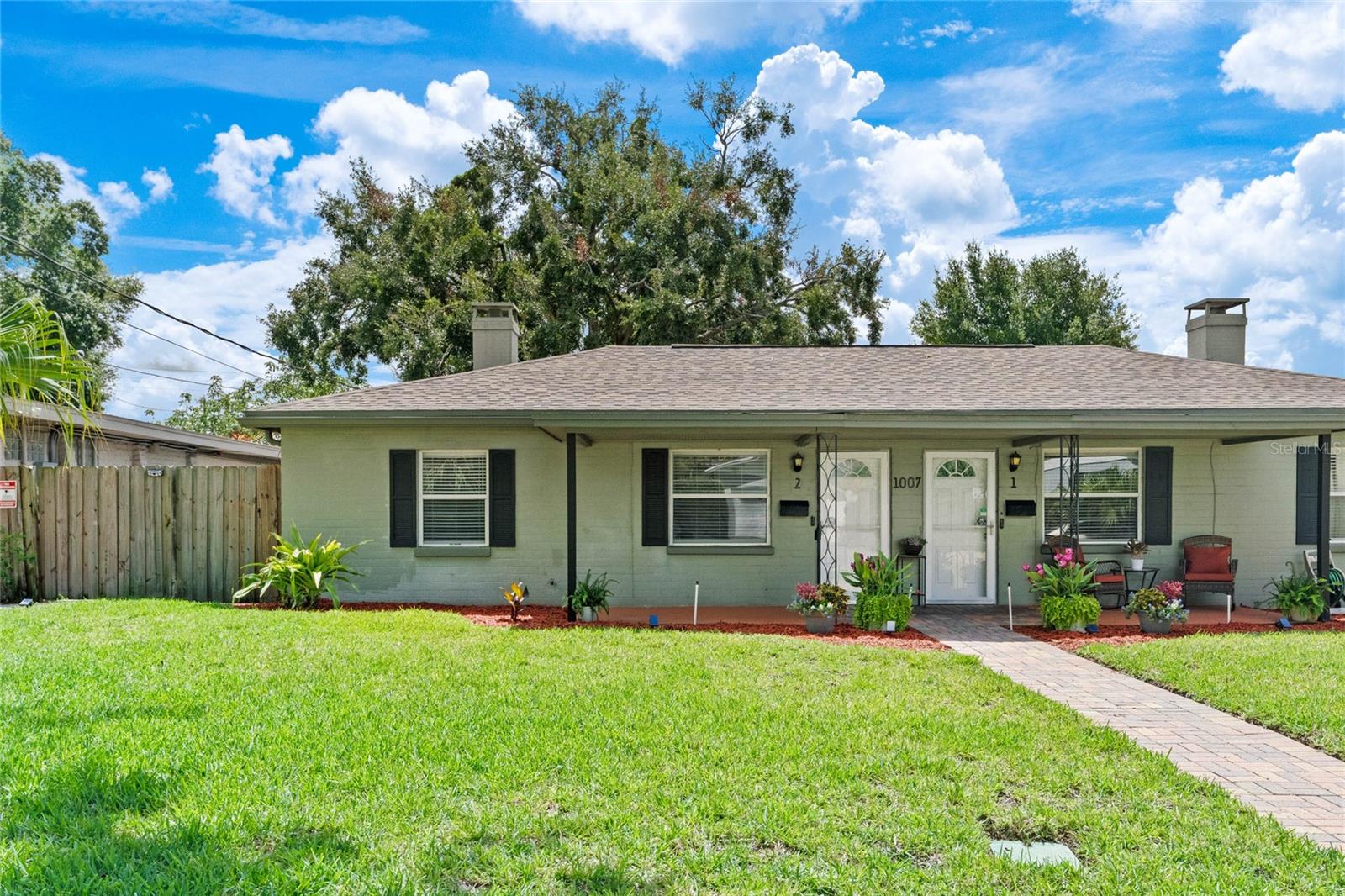 This duplex is pristine inside and out in the heart of the MILLS/50 district! It has a huge, fully fenced-in, amazing backyard with a 20x18 paver patio. There are two dedicated parking spaces, one of which is covered. Walk to all the trendy places to dine, the lovely places for entertainment, and the fashionable stores to shop. All newer stainless appliances, along with a brand new washer and dryer. NO CARPET, all ceramic tile. Fresh paint, newer blinds. Rent includes landscaping/lawn care, pest control, and antenna TV in the living room and front bedroom. The area has some of the most desirable city parks, including the Dinky Line bike/running/walking trails, Big Tree Park, Lake Highland Park, and many others. Small doggies or cats 15 lbs or under, ok! Available 10/1/2025. The water and sewer charge is $50.00 per month.
