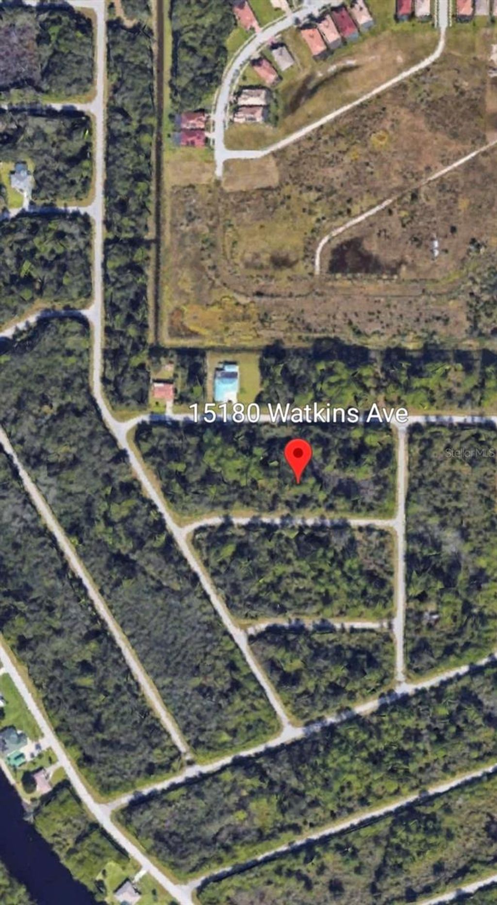 Photo of 15180 Watkins Avenue, Port Charlotte, FL 33953 (MLS # OM711291)