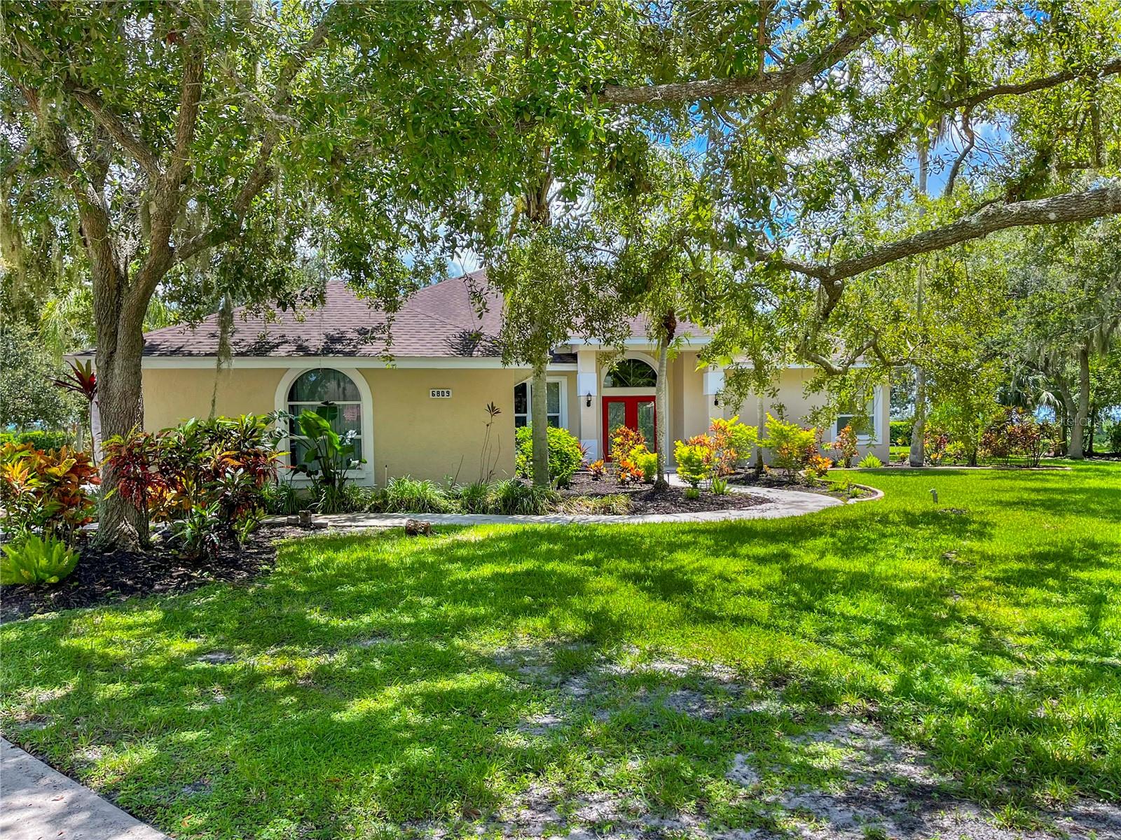 This is a beautiful 3 bedroom 3 bath pool home at the end of the Cul-de-sac in the gated Golf and Tennis community of Serenoa. This home sits on a lushly landscaped half-acre lot with a lake at the rear of the property and has a side entrance 2 car garage. This home features an open floor plan, cathedral ceilings, tile and wood floors, a family room with a floor to ceiling stone fireplace, and formal living and dining area. The kitchen has an island with a glass stovetop, stainless steel appliances, a built-in stove, plenty of cabinetry, and a tile backsplash. The living room, dining area and master bedroom have access to the spacious patio and pool with spa and lake views. The master bedroom has its own access to the patio and his/hers walk-in closets. The ensuite master bathroom has a garden bath with a separate walk-in shower. There are two additional spare bedrooms and two additional spare bathrooms. Both bathrooms feature walk-in showers.There is a pantry near the kitchen that also has a washer, dryer, and access to the 2 car garage. The community of Serenoa Lakes has an optional annual golf membership at Serenoa Golf Club. The community is located near Twin Lakes Park, dining, shopping, medical facilities, major roadways, and award-winning beaches. We score every application. If an application doesn’t score high enough, the resident may be required to place the equivalent of two months’ rent in a security deposit. Please be aware that leasing this property includes a non-optional Home Assistant Services Package that will cost an additional $30 per month. These services and their cost are separate from Tenant’s monthly rent payment and all other payments described in the Lease or any separate Lease addendums. The Home Assistant Services offered are described in the Resident Welcome Packet which can be viewed here: www.sarasotamanagement.com/home-assistant/