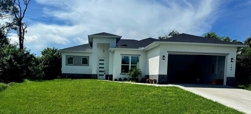 Photo of 165 Ingram Boulevard, Rotonda West, FL 33947 (MLS # O6344749)