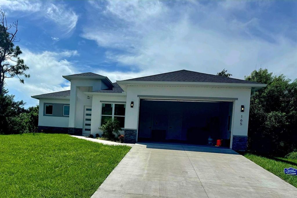 Photo of 165 Ingram Boulevard, Rotonda West, FL 33947 (MLS # O6344749)