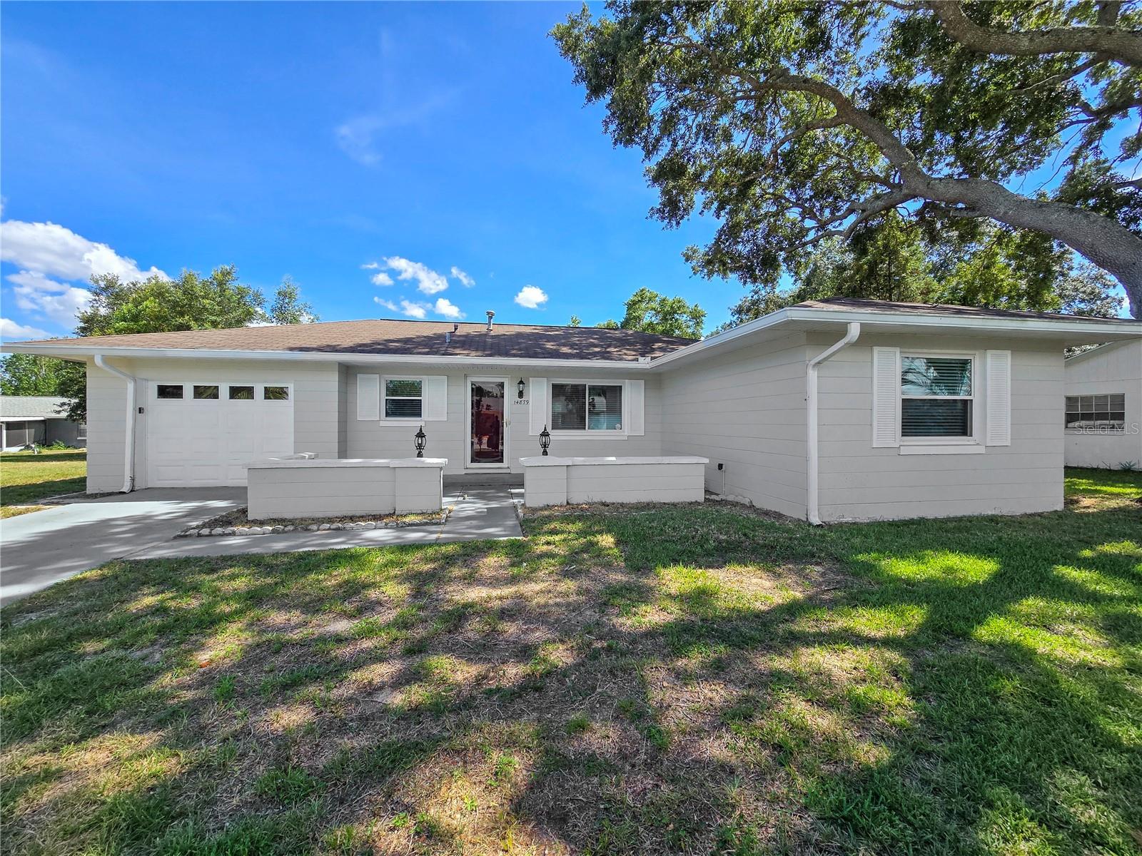 Welcome to this charming 3-bedroom, 2-bath home in Ocala, FL, boasting a fenced yard for privacy. Step inside to discover a spacious living area, perfect for gatherings and relaxation. The modern kitchen is equipped with ample storage, making meal preparation a breeze. Retreat to the tranquil master suite featuring a separate bath and closet. Two additional bedrooms offer versatility for guests or a home office. Home is hardwood and tile throughout, easy clean for beach days! Fenced yard for privacy! With its convenient location and inviting atmosphere, this home is a true gem in Ocala.