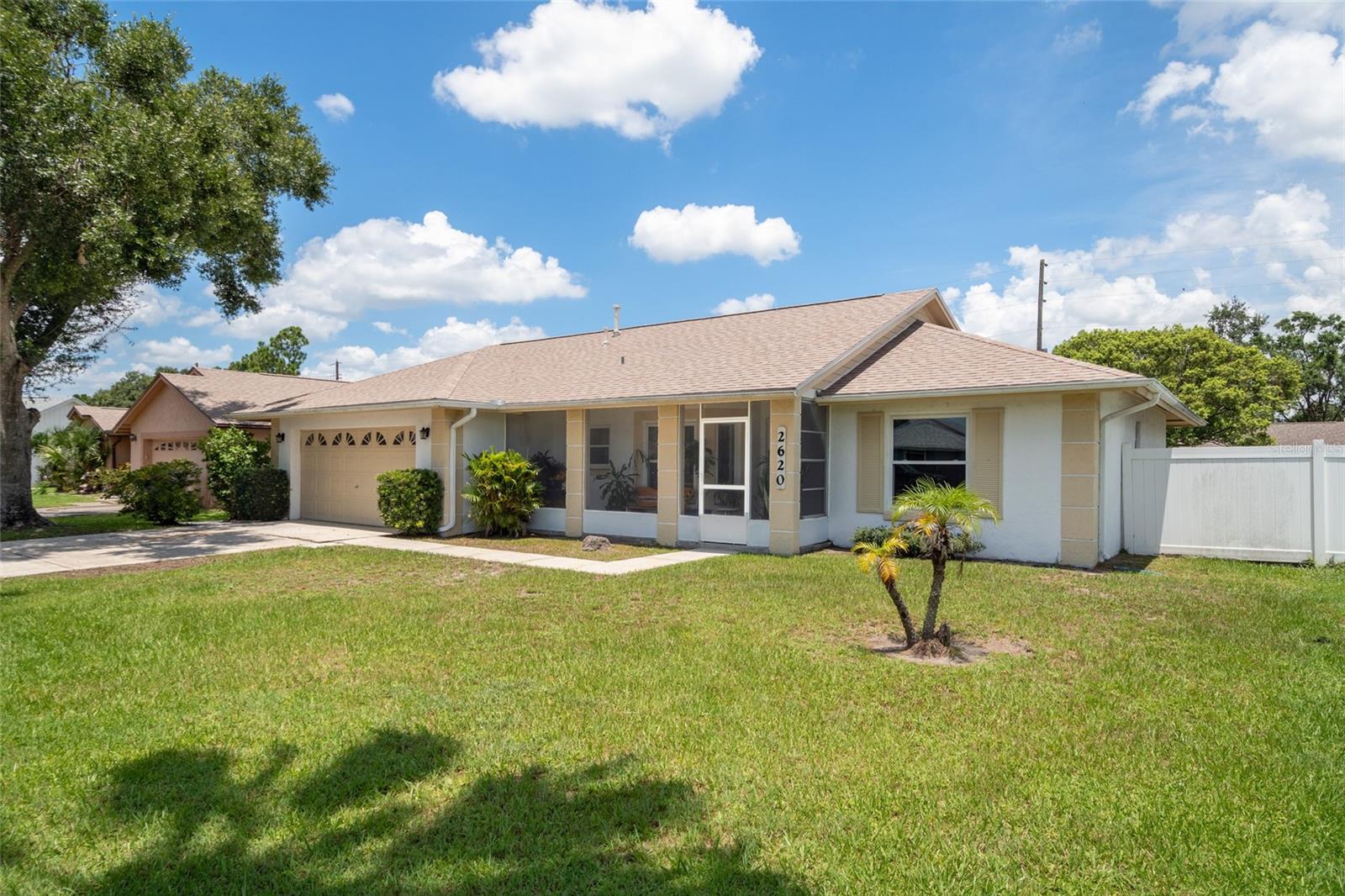 Nestled in the desirable Peppermill community in Orlando, this move-in-ready 3-bedroom, 2-bathroom home with a 2-car garage offers just under 1,523 sqft of living space under air. The home boasts a split floor plan, a new roof in 2023, a screen-enclosed front porch and rear lanai, and fully electric utility building in the backyard. The spacious living room features glass sliding doors that seamlessly blend indoor and outdoor living, opening to a covered and screened lanai. The kitchen offers ample cabinet and counter space, with vinyl flooring, stainless steel appliances, closet pantry, and plenty of natural lighting from bay windows at breakfast nook and kitchen sink. The spacious primary suite has split vanities, large windows with great backyard views, walk-in closet, and access to backyard through exterior bathroom door. The split floor plan ensures privacy for the two additional bedrooms, which share a hallway bathroom with tub/shower. Step outside to discover a truly tranquil backyard, ready for your personal touch. Envision creating your own private oasis, garden, play area, or a future pool for relaxation. The fully fenced yard provides both privacy and ample space, making it an ideal setting for your outdoor enjoyment. Located just minutes from plenty of great shopping, dining and entertainment.