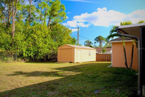 Photo of 421 NW Helicon Avenue NW, Palm Bay, FL 32907 (MLS # OM712368)