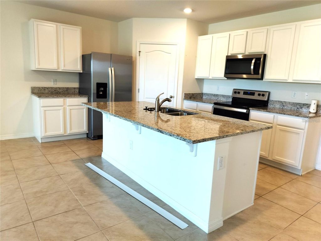 Photo of 405 Noble Avenue, Davenport, FL 33837 (MLS # S5148544)