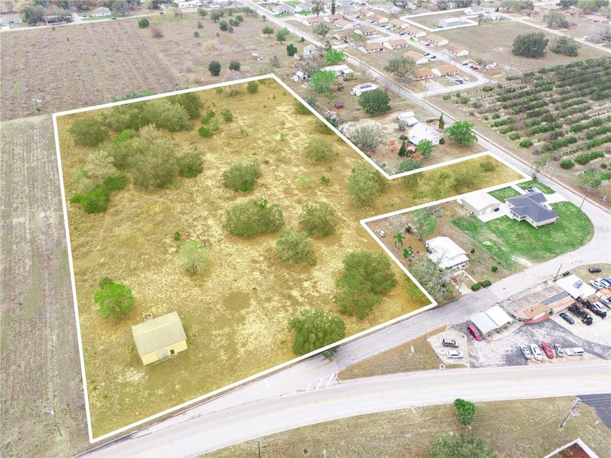 GREAT INVESTMENT OPPORTUNITY IN HIGH GROWTH AREA!!!  Two parcels (lots) side by side, totaling 6.82 acres, with 362' frontage on Scenic Hwy in Frostproof, FL. Currently zoned AG, Future Land Use Residential. Possibility exists for Future Land Use change to Commercial or Light Industrial. There is a 40' X 32' concrete block storage building, built in 1990, with electricity, a single garage door and separate entry door.  Additionally, there is a 120' deep well with submersible pump installed by previous owner and current owner has no knowledge of its age or how it functions.  Located less than a mile from Ferguson & Lowe's Distribution Centers and 6 miles to Nucor Steel manufacturing, with easy access to HIGHWAY 27, a major North/South artery through Central FL.  Within an hour's drive to local attractions such as Westgate River Ranch Resort & Water Park, Bok Tower Gardens, LEGOLAND, Highlands Hammock and the Sebring Raceway.  International Airports can be found in Orlando or Tampa, as well as area attractions.  Central Florida location also gives easy access to Florida's East or West coast Interstate roads.   If you are looking for a centrally located investment opportunity in a high growth corridor, this is it.  Don't let it slip away--Call Today!!!
