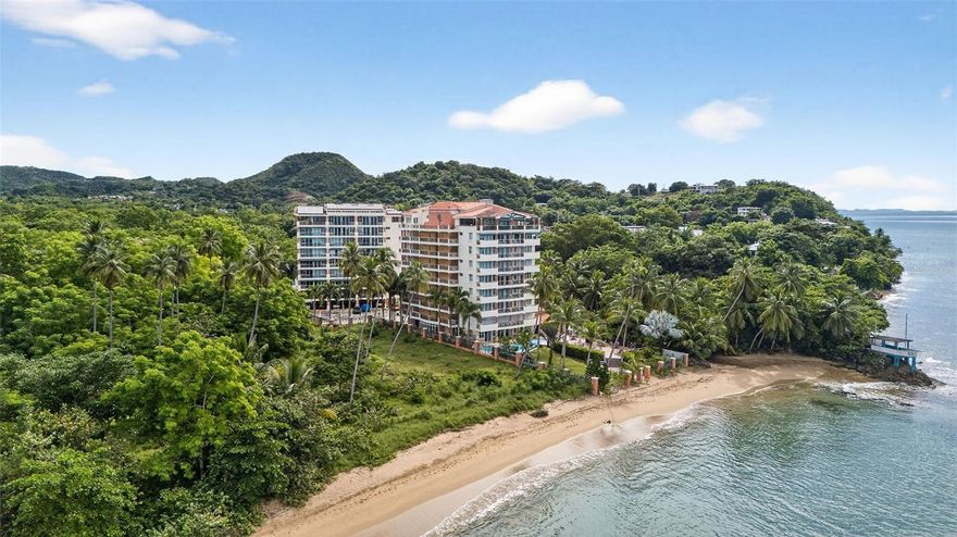 Experience elevated coastal living in this fully remodeled penthouse in Macor By The Sea community of Rincón. This 2-bedroom, 2-bath residence has been transformed with custom craftsmanship and high-end integrated finishes, offering a seamless turn-key luxury home.The open-concept kitchen showcases custom cabinetry, built-in oven, built-in stovetop, built-in microwave, built-in dishwasher, and custom quartz countertops. Enjoy premium conveniences such as a built-in Miele coffee maker, whole-house water purification system, and reverse osmosis drinking station. A built-in washer/dryer adds functionality while maintaining a sleek design. Refined upgrades continue with custom lighting, remote-controlled blinds, remote-controlled balcony awnings, all-new windows and doors, and a custom LED ambient fireplace that elevates the living space. From the privacy of your balcony, take in breathtaking Desecheo Island views and dreamlike sunsets, creating an unparalleled coastal backdrop. The guest bedroom includes a custom built-in Murphy bed, allowing the room to double as an office. Three Samsung energy-efficient mini splits ensure comfort throughout, while the in-unit sauna adds a spa-like touch to everyday living.The property includes two parking spaces—one covered, plus the convenience and peace of mind of back-up generator power and a water reserve system. Macor By The Sea offers direct beach access, pristine landscaping, and top-tier amenities including a pool, gym, game room, gathering room, and a communal grill and entertainment area, ideal for hosting and enjoying the coastal lifestyle.This penthouse is move-in ready, masterfully upgraded, and designed for those who value luxury, function, and the prestige of one of Rincón’s most desirable communities. Schedule your private showing today.