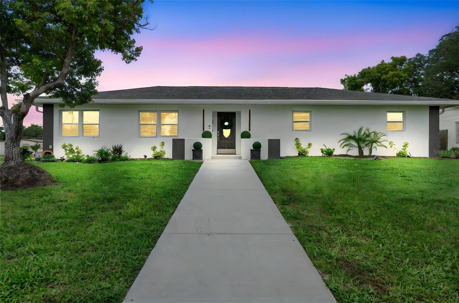 This Beautiful 3-bedroom 3-bath home is situated on a corner lot! It has been tastefully updated and is move in ready. The bright open living room flows seamlessly while the updated kitchen overlooks the dining space with a large built-in island. Enjoy the abundance of natural light through the brand-new windows and doors adding both style and energy efficiency. Additional highlights include an interior laundry room and spacious screened porch. NO HOA! Plenty of space to park your boat or RV. Conveniently located near shopping, dining, schools and major roadways. This home offers access to everyday essentials while still tucked away. Call for more details!