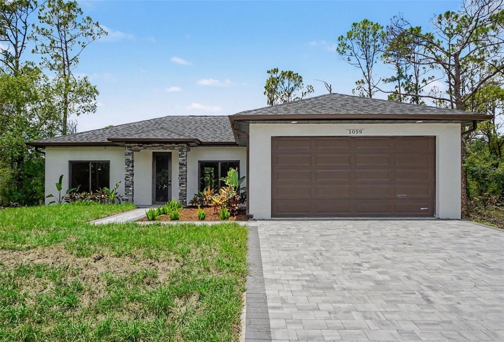 Photo of 1059 Madeira Street, Port Charlotte, FL 33953 (MLS # TB8526178)
