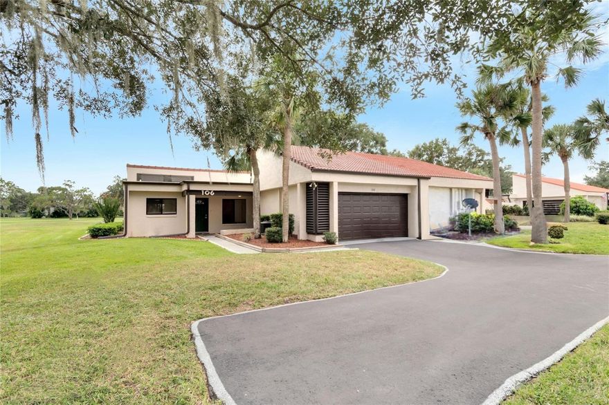 One or more photo(s) has been virtually staged. A *RARE* WALDEN LAKE VILLA WITH 3 BEDS, 2 BATHS, & 2-CAR GARAGE WITH GOLF COURSE VIEWS.  *STUNNING UPDATES THROUGHOUT*   This special property begins with the location of the villa within the community and includes extra parking, in addition to the garage and driveway, and an open side yard with mature trees and landscaping.  Step inside to the Dining area that flows into the main living area with soaring ceilings, multiple sliders for lots of natural light, and fresh and modern finishes. There are many updates to mention throughout including the Kitchen with stainless appliances, shaker-style cabinetry, and quartz counters overlooking the spacious Great Room with triple-sliders to the ~270 sq ft screened lanai with golf course views.  A split plan for the bedrooms provides space and privacy for the Master Suite with a walk-in closet and a stunning en-suite bath with a gorgeous walk-in shower, dual sinks with quartz counters, and amazing tile work.  Two secondary bedrooms are far from ordinary with one featuring double sliders to the lanai and the other has an extra nook that is ideal for a desk for studying or work from home.   The second bathroom has a tub with a shower and is unique in the very best way with high-end tile, quartz counters, and finer finishes.  All the flooring, paint, ceiling fans (including the lanai), light fixtures, baseboards, and electrical outlets with USB ports have been replaced and refreshed in this home.  Even the garage has an epoxy floor finish for easy cleaning and a new garage door.  In addition to being move-in ready, the wider community provides plenty to do for active lifestyles including a pool right around the corner and miles of winding sidewalks to walk, jog, and bike.  Thank you for your interest and for taking the time to see this beautiful villa in person.