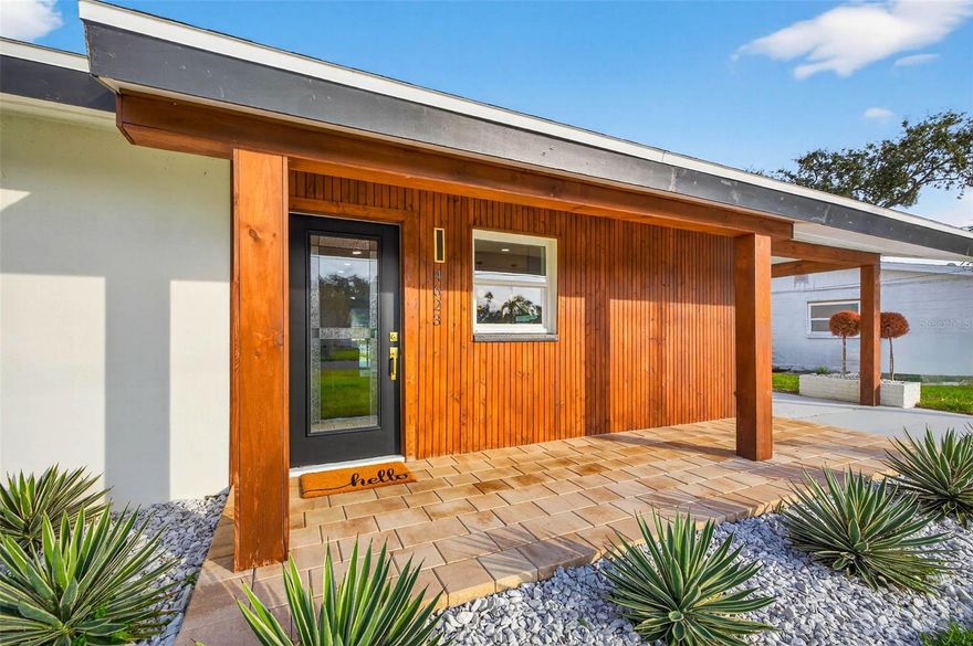 Captivating Coastal Retreat in one of Northeast St Pete’s most coveted waterfront enclaves. This beautifully reimagined three bedroom, two bathroom residence blends modern design, effortless elegance, and true Florida waterfront living into one unforgettable home. Imagine waking each morning to shimmering sunrises dancing across the water, sipping coffee on your private dock as dolphins glide by—it’s the kind of everyday magic only this address can offer. Set along a serene canal with a generous 74 feet of waterfrontage and direct access to the open waters of Tampa Bay and the Gulf, this property delivers the rare combination of privacy, boating, and year-round natural beauty. From the moment you step inside, the home’s airy, modern aesthetic unfolds in spectacular fashion. Sunlight pours through new windows, illuminating wide-plank flooring and clean, streamlined architectural lines that give the entire space a bright, elevated feel. Every major improvement has been handled for you—new HVAC, new windows, updated electrical, new water heater, newer roof, and premium finishes throughout—making this home truly turnkey and worry-free. The open-concept living area is thoughtfully designed - you’ll find a cohesive layout that feels both sophisticated and relaxed. Every inch of this home has been meticulously renovated with a designer’s eye, including a full kitchen transformation featuring custom cabinetry, quartz surfaces, designer lighting, and sleek stainless appliances—an entertainer’s dream with an unmistakably high-end touch. The primary suite is your private waterfront sanctuary, offering unobstructed views of your pool deck and sparkling canal. Spa-inspired finishes elevate the ensuite, from the elegant tilework to the custom vanity and luxe fluted wall details. Slide open the glass doors and transition seamlessly to your outdoor retreat, where a redesigned deck, new pavers, and lush landscape frame the perfect setting for sunset cocktails, weekend gatherings, or a quiet evening by the pool. And the location? Unbeatable. You're minutes from Downtown St. Pete by boat, bike, car, or golf cart. Cruise through a friendly, festive neighborhood, explore the waterfront parks, or spend the day wandering the boutiques and restaurants of Beach Drive. It’s a lifestyle that strikes the perfect balance between peaceful retreat and vibrant city access. With its thoughtful redesign, luxury finishes, and premier waterfront position, this move-in-ready masterpiece stands out as one of Northeast St. Pete’s finest offerings. Come experience firsthand what exceptional waterfront living truly feels like.