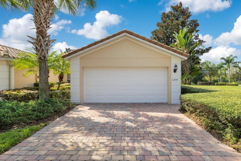 Lovingly maintained by its original owner since 2012, freshly painted and move-in ready! This 3-bedroom, 2-bath , end-unit villa in Village Walk at Lake Nona offers both comfort and convenience in one of Orlando’s most sought-after communities. Overlooking tranquil green space, the home features a tile roof, paver driveway, and a rear screened patio. This home combines charm with low-maintenance living. The kitchen is a true highlight with granite countertops, stainless steel appliances, and a breakfast bar overlooking the spacious living/dining combo—perfect for entertaining. The third bedroom makes an ideal guest suite or home office. A laundry room with washer, dryer, and sink adds extra convenience. Village Walk residents enjoy a resort-style lifestyle including heated pools, a 24-hour fitness center, lighted walking/biking trails, sports courts, and even on-site conveniences like a deli and gas station. The HOA fees cover lawn care, high-speed internet, and cable, making life simple. Just minutes away, explore Lake Nona Town Center with upscale shopping, dining, the iconic Wave Hotel, Boxi Park’s entertainment and dining options, and miles of landscaped paths. Families will appreciate access to top-rated A-rated schools, and the location is unbeatable—close to hospitals, the UCF School of Medicine, and Orlando International Airport. This home truly offers the best of modern living with a vibrant community atmosphere. Don’t miss your chance to call Lake Nona home!