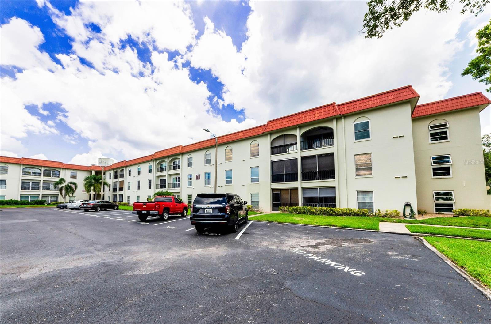 Great location in Delightful Dunedin, on Travel & Leisure’s 2025 list of Top 10 places to live. You will love to call home this 2 Bedroom, 1 Bath Condo plus Covered Parking in Mediterranean Manors. This beautiful all-age community near the Dunedin Causeway offers a pool, clubhouse, umbrella sitting area, library, gym, tennis/pickleball courts, shuffleboard, bocce ball, kayak storage, locker in the covered parking space, beautiful courtyards in the building center and a waterfront park/beach with possibility of a boat mooring just off the community park. This second floor condo has a protected inside entrance with beautifully kept hallway and service door into the kitchen. The foyer welcomes you and presents a spacious great room with flexibility to accommodate a Living Room and game or library/Office space with storage closet. The Kitchen has plenty of cabinet storage space is adjacent to a Dining Area. Both Bedrooms are roomy with nice closet space and are bright and airy with floor to ceiling windows. Hurricane damage from some spots of rain/wind has been professionally repaired and is ready to be primed and painted to fit your personal décor preferences. The community has competed all Milestone Inspections, SIRS, Repair requirements and all assessments have been paid. The condo has been meticulously maintained and is perfect for updating to your taste. Desirable Covered parking is assigned to this condo. Located near the gateway to the Dunedin Causeway, Honeymoon Island State Park, the ferry to renowned Caladesi Island, near Golf, Marina (currently being renovated), Fine Arts Center, Community Center, parks, breweries, restaurants, hospitals, entertainment. Easy drive to the Tampa International Airport, famed Clearwater Beach, Tarpon Springs Sponge Docks, Tampa Arts District and Champion Sports centers, and so many activities and festivals. Come live a true Florida Lifestyle!