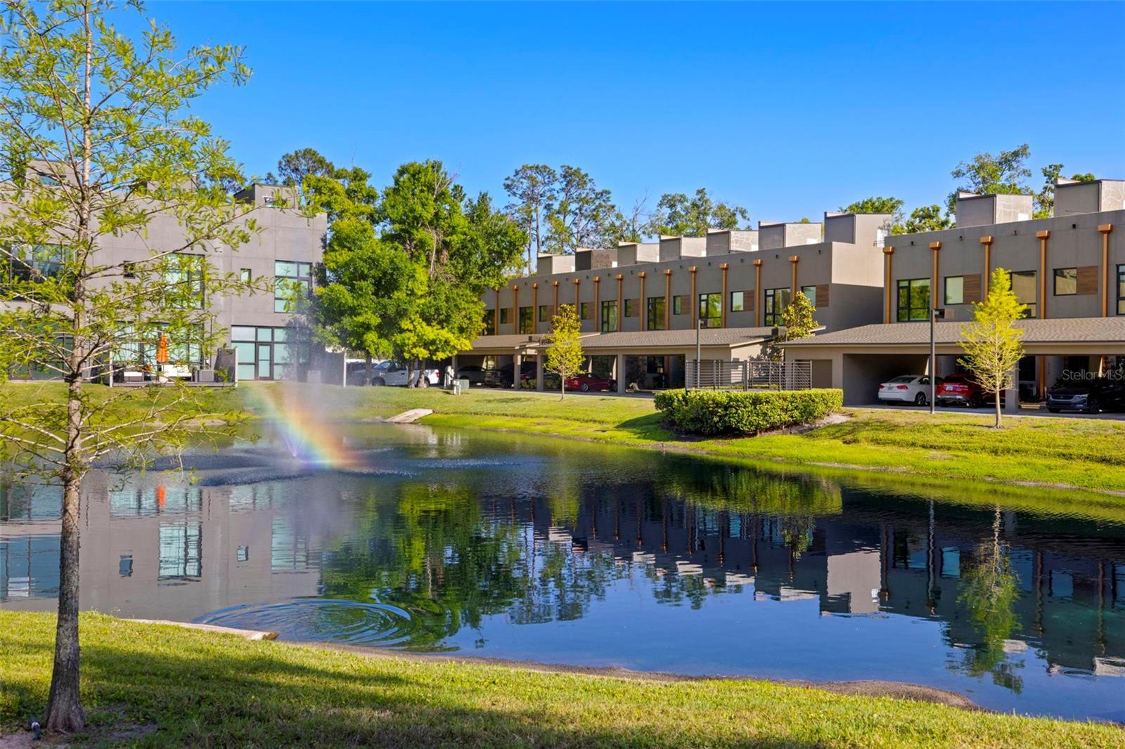 **Up to $5,000 towards closing costs with seller's preferred lender! ** Welcome to this striking 3-bedroom, 3-bathroom ultra-modern loft nestled in a secure gated community, where architectural design meets effortless luxury. From the moment you step into this end-unit townhome, you're greeted by dramatic exposed steel beams, sleek tile flooring, and a statement chandelier that sets the tone for this one-of-a-kind space.The expansive floor-to-ceiling window in the living room floods the home with natural light, complemented by a skylight that brings the outdoors in. Each generously sized bedroom features its own en-suite bathroom for maximum comfort and privacy. Thanks to the 24-foot ceilings, on the second floor loft you will have open air views of the downstairs. Take the stunning spiral staircase to the third floor private rooftop terrace, perfect for entertaining or relaxing under the stars. One bedroom offers peaceful pond views, and with no backyard neighbors, you’ll appreciate the added tranquility. A brand new roof adds peace of mind, while the 1-car garage and additional carport space provide ample parking. With clean modern lines, industrial accents, and thoughtful design throughout, this loft is more than a home—it’s a lifestyle. Just 20 minutes to downtown Tampa, you’ll enjoy quick access to the city while retreating to your private modern sanctuary. Don’t miss this rare opportunity—schedule your private showing today! Seller is offering the option to purchase the majority of the furniture and artwork!