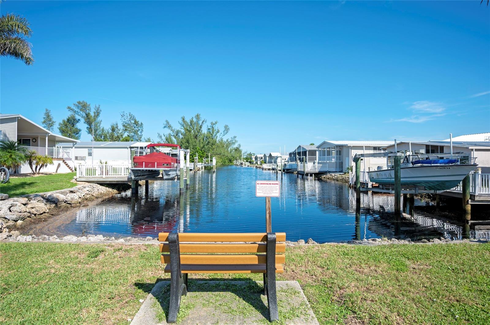 Experience Florida living with this coastal 2 bedroom, 2 bath canal front home in Punta Gorda, offering easy access to Peace River and local amenities like parks and downtown shopping. Enjoy water views from your backyard, perfect for fishing, launching a kayak and relax with the convenience of proximity to outdoor attractions and the vibrant culture of the quaint downtown Punta Gorda. Fully paid permits approved to install a 25' boat dock and 7,000 lb. lift. New carport in 2023, vapor barrier and air ducts replaced in 2024, porch add on is 21'x10' under air. Must see to appreciate.