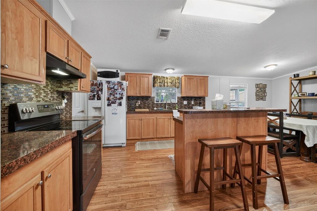 Photo of 163 West Street, Oak Hill, FL 32759 (MLS # V4948669)