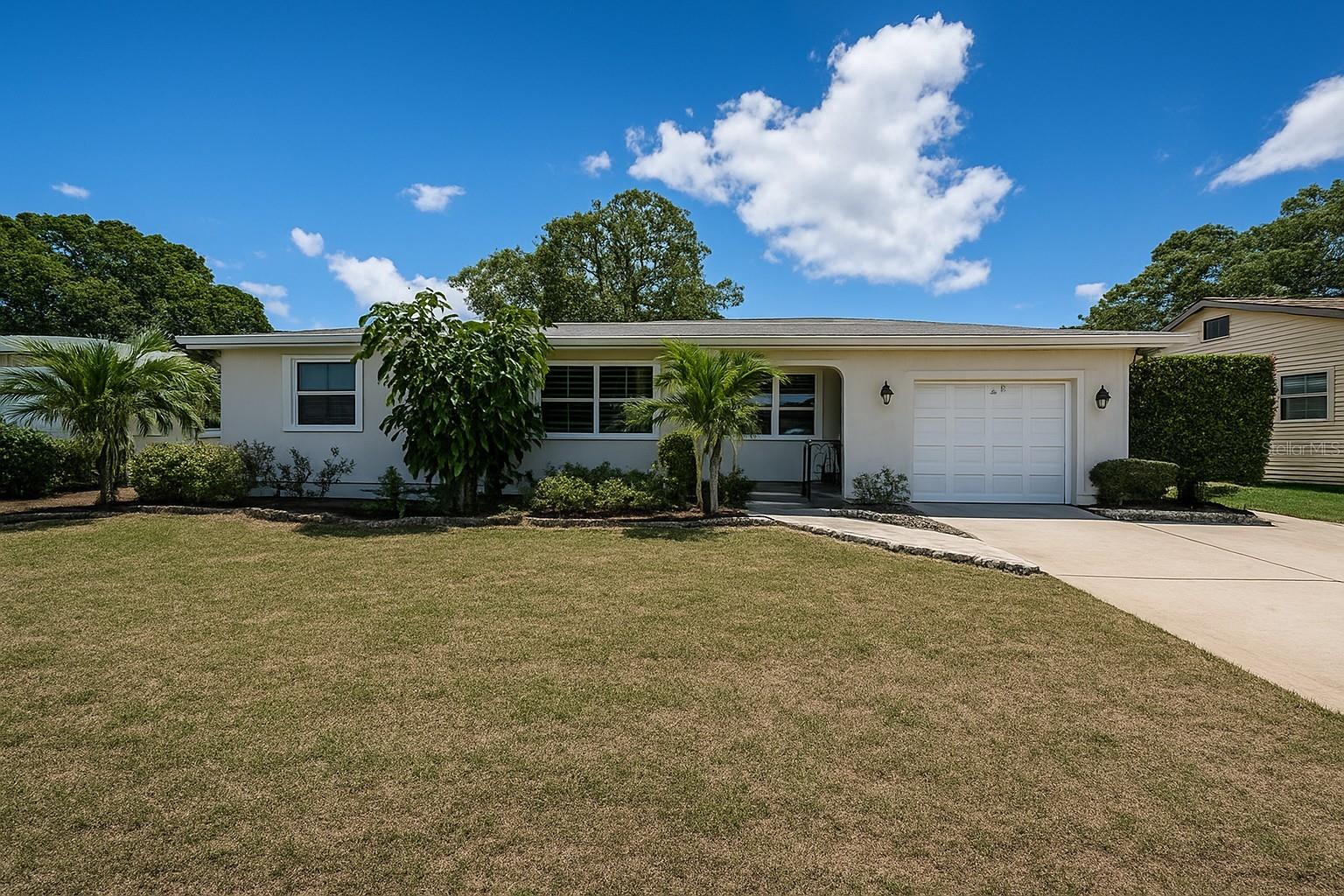 One or more photo(s) has been virtually staged. Welcome Home to the Heart of Pinellas County!
This beautifully maintained three-bedroom, two-bathroom home sits on a quiet cul-de-sac and is loaded with character, offering the perfect blend of comfort and convenience. From the welcoming front porch, step inside to a bright and inviting open living area where sunlight pours through double-paned windows, highlighting the solid hardwood floors and freshly painted interior.
The thoughtfully designed split-bedroom layout provides privacy for everyone, with the rear bedroom featuring its own full bathroom—perfect for guests, extended family, or a teenager seeking their own retreat. The kitchen offers solid countertops and a cozy dinette just steps away, making it a warm and functional space for everyday living.
The open flow of the living and dining areas extends to the oversized backyard, where there’s plenty of room to relax, entertain, or even create your dream outdoor space with a pool or custom entertainment area. With a roof replaced in 2019, this home is move-in ready and offers peace of mind for years to come.
Best of all, the property is located in a non-flood zone with no HOA, giving you the freedom to truly make it your own. Ideally situated just five miles from Downtown St. Pete, eight miles from the beaches, and sixteen miles from Tampa International Airport, you’ll love the balance of tranquility and accessibility.
Don’t miss the opportunity to make this charming home yours—schedule a showing today and start planning your Florida summers!