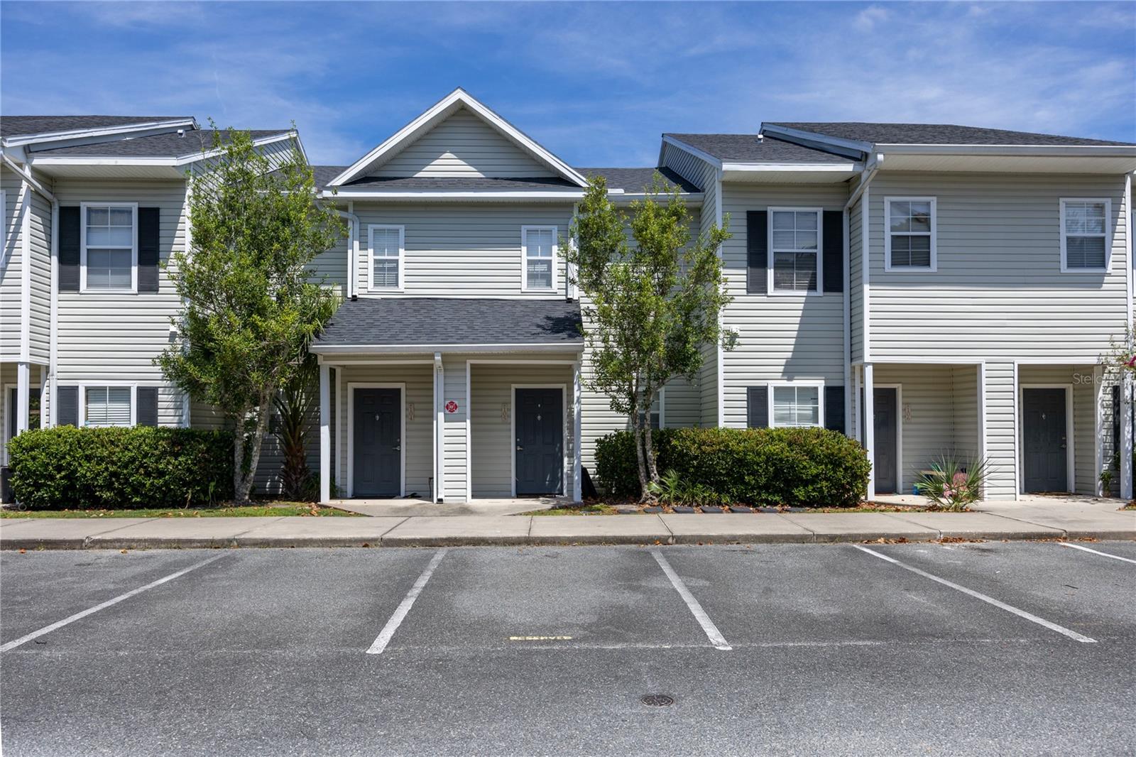 Welcome to this charming townhome nestled in the highly desirable community of Magnolia Place. Great location off NW 39th near Thornebrooke Village, Magnolia Park Plaza, I-75, Santa Fe College, and many great shopping and dinning options. Two-story floor plan with a large living room, kitchen, half bathroom, and screened in patio on the first floor. The carpeted stairwell leads to a short hallway landing where your full size washer and dryer are located along with the entrance to the master bedroom. The master bedroom is very spacious with vaulted ceilings that peak over 11 feet. There is a large walk in closet with shelving and a roomy bathroom with a tub and shower. Community amenities included trash pick-up, swimming pool, outdoor grills, playground, fitness center, car wash area, and a clubhouse. Perfect for someone who is downsizing, grad students, and everyone in between.