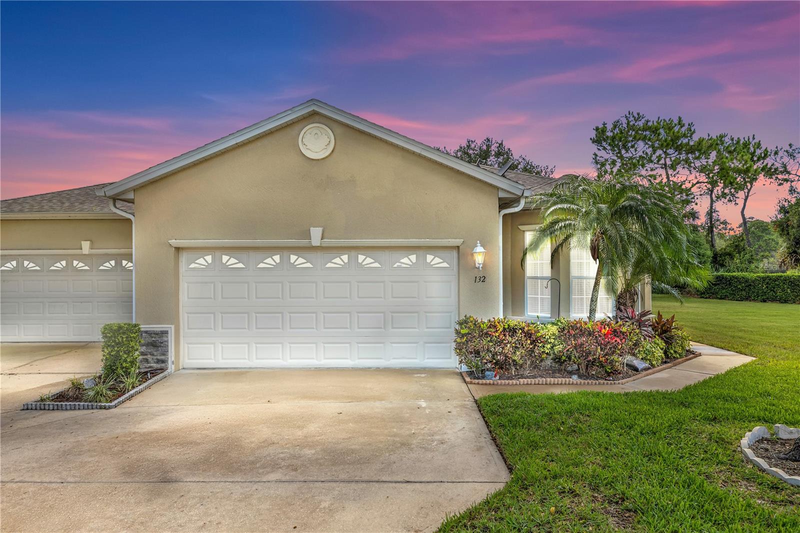 Welcome to this beautifully maintained END-UNIT villa, perfectly situated on a quiet cul-de-sac with serene lake views in the sought after DeBary Golf and Country Club! This open floor plan offers a seamless flow throughout, featuring laminate wood flooring, no carpet, and tile in the bathrooms and screened-in patio. The spacious kitchen is designed for both style and function with granite countertops, stainless steel appliances, pull-out drawers, and a built-in desk. Enjoy casual meals in the dining area highlighted by an elegant trey ceiling, or step outside to the extended paver patio and screened-in lanai, complete with tile flooring and a ceiling fan, ideal for enjoying the tranquil lake views. The primary suite features trey ceilings, sliders to the patio, and stunning lake views to wake up to each morning. French doors lead into a versatile flex space, perfect for an office or additional sitting area. Additional highlights include a 2024 roof, brand new A/C installed in 2025, and extra storage space in the garage. This home has NEVER experienced any flooding, offering peace of mind in a prime location! LOW MAINTENACE HOME, lawn maintenance is covered by the HOA dues. DeBary Plantation is conveniently located near shopping, dining, I-4, SunRail, and the St. Johns River, with easy access to Downtown Orlando and the beaches. Schedule your private tour today. This home may be under audio or visual surveillance.