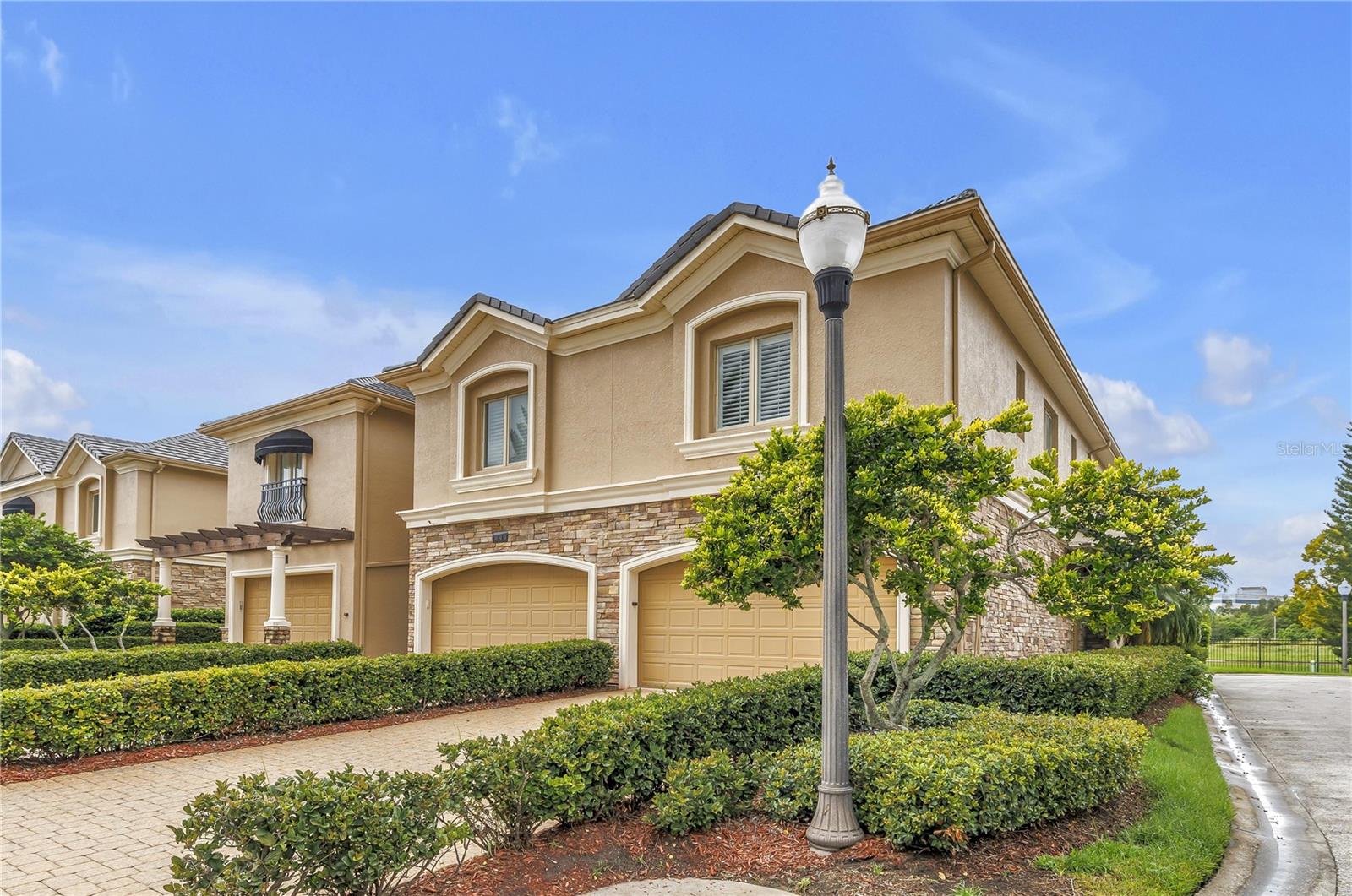 Welcome to the premiere gated community in the Carillon area - SAXONY PLACE. Featuring solid block construction both levels, high end features and finishes, 10' ceilings and an exceptional floor plan for the most discerning buyer. This end unit is located on the cul de sac in a desirable location in the community. Enter thru a foyer entry to the formal dining at the front of the home. Curved and inset walls, custom molding and niches allowing you to highlight your art and collected treasures. A chef's kitchen built for entertaining with an expansive breakfast bar providing connection to the living area and eat-in breakfast nook. Extensive storage in the solid wood cabinetry with tiled backsplash and BRAND NEW high quality Frigidaire Gallery stainless steel appliances. The appliances include convection oven, glass cooktop and new refrigerator and dishwasher. In the living area you will enjoy large space to spread out with wood burning fireplace with hearth and double sliding doors. The screen enclosed lanai adds more than 250 sq ft of outdoor living to enjoy the Florida weather and lush landscaping provides privacy. Powder bath on the first floor for guests is adjacent to the attached 2 car garage. A wide staircase from the living area leads upstairs to a landing that separates THREE BEDROOM SUITES. The main suite features an oversized bedroom with wood burning fireplace, plantation shutters, office with French doors for privacy, two expansive walk-in closets with custom closet systems and a bath outfitted for luxury with a large walk-in shower, deep soaking tub, double vanity with added storage and linen closet. The second and third bedroom each have a private bath with shower. Upstairs the laundry room has upper cabinets and the home includes exceptional storage throughout. Exterior features stacked stone accents, paver driveways and walkways, lush landscaping and hurricane rated Pella casement windows. If you are seeking a "walking neighborhood" - come check this out - several walking trails are right outside your door with Florida wildlife and birds and the expanding shopping center offers several restaurants, grocery and conveniences. Easy commuting with access to I-275 to downtown St Pete, Tampa & Clearwater. HOA fee is $550 per month and covers lawn maintenance, pest maintenance, roof, security patrol and secure gated access. Exterior painted 2019. Zoned HVAC systems replaced 2025 & 2024, Roof replaced 2022, Water heater 2025, Water treatment system 2025, all new ceiling fans, brand new carpet, new paint. Ready to move in and start enjoying life!