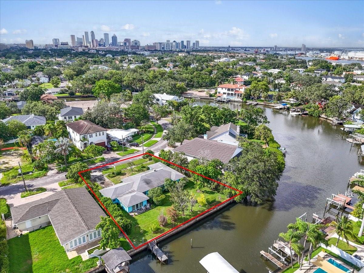 Build your dream home on this rare canal-front lot at 545 Suwanee Circle. Offering 108 feet of waterfrontage along the canal and situated on a spacious 0.32-acre lot (approximately 13,939 sq ft), this property boasts direct access to the Bay, perfect for waterfront living. Originally built in 1949, the existing structure experienced water intrusion and is being sold AS IS for land value, presenting an exceptional opportunity to create a custom waterfront estate. Surrounded by multi-million-dollar properties, this is your chance to design a luxury residence in one of Tampa’s most sought-after neighborhoods. Located in a NO HOA and NO CDD community, Davis Islands offers an unbeatable lifestyle: a vibrant, golf cart-friendly village with popular restaurants, coffee shops, boutiques, parks, playgrounds, marinas, sailing and yacht clubs, a private airport, community pool, clay tennis courts, dog parks, and a public boat ramp. Essential services, including Tampa General Hospital, a fire station, and a post office, are all conveniently nearby. Located within the highly rated Gorrie, Wilson, and Plant school district, and just minutes to Downtown Tampa, Bayshore Boulevard, Hyde Park Village, Riverwalk, Sparkman Wharf, and Tampa International Airport, this property offers both luxury and convenience. Waterfront properties on Davis Islands are always in high demand. Don’t miss this incredible opportunity to enjoy the ultimate island lifestyle. Call today to explore the endless potential!