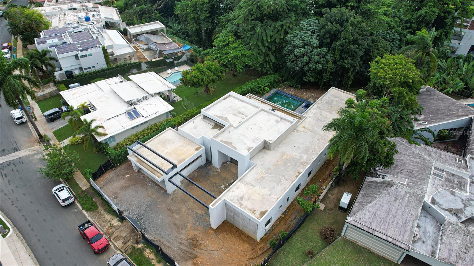 Under Construction. Currently approaching completion, this single-level architectural masterpiece - set to be finalized for the sale- embodies a perfect balance of elegance, comfort, and natural beauty in one of San Juan's most desirable communities: San Francisco.
This exquisite 5-bedroom home has been meticulously designed to deliver an unparalleled living experience. Each bedroom features an ensuite bathroom and spacious walk-in closet, while the primary suite showcases a magnificent 12x12 dressing room and serene views of the private pool with over 5800 square feet of construction. Set against a lush, forested backdrop, the home offers a rare sense of tranquility where native flora and birdsong create an atmosphere of refined seclusion.
Soaring 16- to 12-foot ceilings and expansive floor-to-ceiling windows bathe the interiors in natural light, accentuating the home’s graceful proportions and open layout. Every element—from the thoughtfully curated finishes to the craftsmanship of its construction—reflects a commitment to quality and sophistication.
Within the exclusive San Francisco community, this residence affords the utmost privacy and security while remaining minutes from the city’s finest dining, shopping, and cultural offerings.