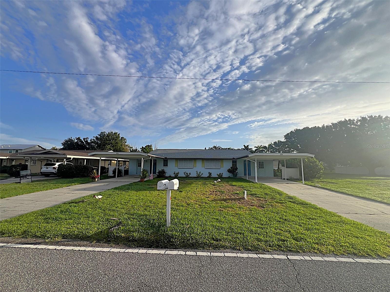 Exceptional Duplex in Prime Punta Gorda – Ideal for Investors or Multi-Generational Living. For investors, this property offers immediate income potential with stable tenants in place. Unit 324 is currently tenant-occupied at $1,325 per month. Unit 320 is furnished and tenant-occupied on an annual lease beginning August 1, 2025, with a monthly rent of $1,800. Whether you're looking to expand your portfolio or seeking a home with built-in rental income, this duplex is a turnkey opportunity. This well-maintained duplex is nestled in the highly desirable community of Punta Gorda. Built in 1974 on an expansive lot with city water and sewer, it features two fully updated units—each offering 2 bedrooms, 2 bathrooms, and 1,096 square feet of modern, comfortable living space. It’s an ideal setup for investors, multi-generational families, or those who want to live in one unit and rent the other. Inside, both homes boast an open-concept layout with polished concrete floors that create a clean, contemporary feel. The kitchens have been tastefully renovated—one with granite countertops and a breakfast bar, the other with quartz countertops. Both feature new shaker-style cabinetry, generous counter space, and easy flow into the dining and living areas. Sliding glass doors open to private screened lanais overlooking a spacious backyard, perfect for relaxing or entertaining. Each unit includes a large primary suite complete with a walk-in closet, single-sink vanity, walk-in shower, and linen closet. The guest bedrooms are also well-sized, with ample closet space, and each unit has a full guest bathroom. Additional conveniences include indoor laundry rooms, extended driveways, and covered carports for ample parking. Recent updates add tremendous value and peace of mind, including water heaters installed in 2018 and 2013, new washers, dryers, and refrigerators added in 2024, and a newer asphalt shingle roof from 2019. Both A/C intake boxes were replaced and systems serviced after the last storm, with no damage reported. The seller is also adding risers to elevate both A/C units. Storm shutters are included, offering added protection during hurricane season. Ideally located just minutes from historic downtown Punta Gorda, Fishermen’s Village, waterfront parks, shopping, dining, and year-round community events, this duplex is also convenient to I-75, US-41, Punta Gorda Airport, and Southwest Florida International Airport. Golfers will enjoy the close proximity to Saint Andrew’s South Golf Club. This is a truly exceptional opportunity to own a versatile, income-producing property in one of Southwest Florida’s most desirable locations. Schedule your private showing today.