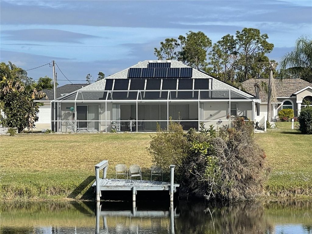 Photo of 640 Boundary Boulevard, Rotonda West, FL 33947 (MLS # D6145080)