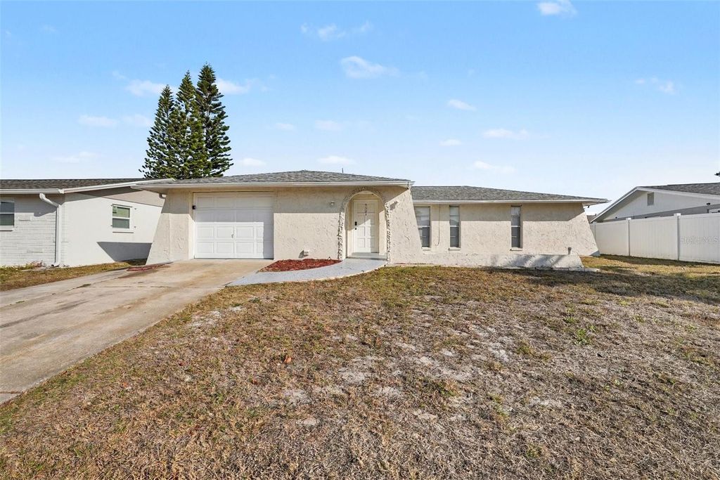 Photo of 7321 S Rosarian Drive, Port Richey, FL 34668 (MLS # O6382341)