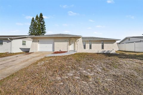 Photo of 7321 S Rosarian Drive, Port Richey, FL 34668 (MLS # O6382341)