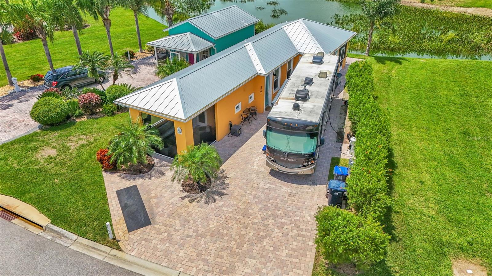 Check out this wonderful casita with water views, front and rear patios, and a large paver pad for your class A. This casita was custom built just 3 years ago, and is offered with all furnishings, fixtures, and appliances included. This casita is 1048 sq ft total under roof. It has a large front porch with automatic roll screens (Water view of Lake Mattie), a cozy back porch overlooking a pond, as well as a large living space with a full kitchen. There is 1 BR with a King bed and its own private master bath, and just off the living room is a 2nd full bath for guests. The lake access road offers a huge advantage for easy access for pulling the coach in and out. Contact us today to schedule a showing!
Bay Lake Motorcoach Resort is a Class A motorcoach resort offering incredible amenities. Owners and visitors can fill their days with activities and club outings or simply relax and enjoy the resort. Whether in search of community, travel, relaxation or recreation, Bay Lake is your home base for the Florida Lifestyle.
