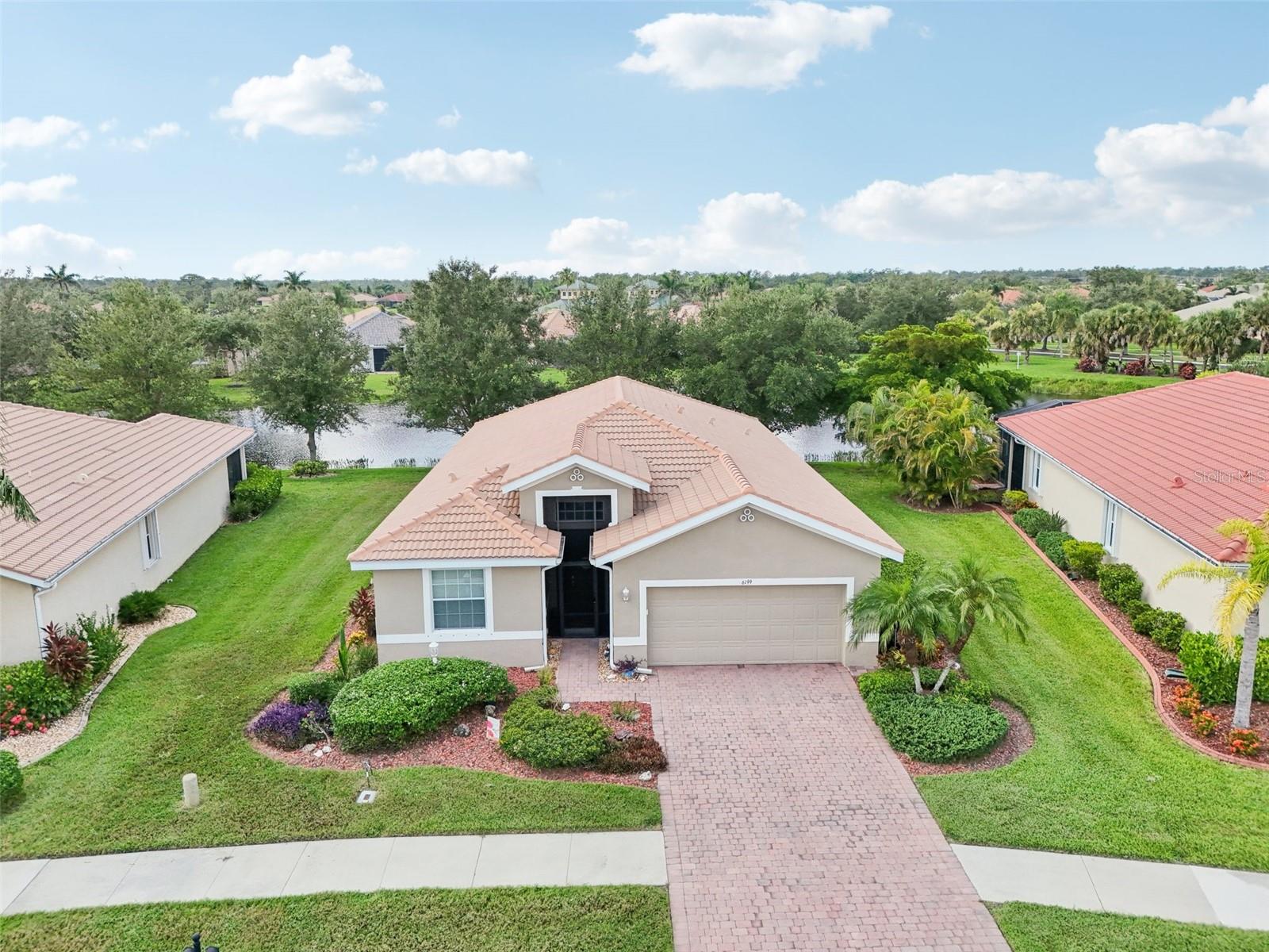 Nestled in the exclusive GATED COMMUNITY of Talon Bay in North Port, this stunning home offers a luxurious lifestyle with privacy and tranquility. Spanning nearly 2,000 square foot of living space, this residence features three spacious bedrooms PLUS a versatile OFFICE or FLEX ROOM, perfect for your work-from-home needs or additional living space.
Step inside to discover exquisite accents throughout, including elegant tray ceilings that enhance the open floor plan. The inviting kitchen seamlessly flows into the cozy living room, creating an ideal space for entertaining or family gatherings. From here, slide open the doors to the expansive 23x24 EXTENDED LANAI, where you can bask in panoramic water views while maintaining privacy thanks to the oak tree canopy —perfect for morning coffee or evening sunsets.
Talon Bay's amenities elevate your lifestyle to new heights. Enjoy a superior clubhouse complete with screened-in OUTDOOR BAR AND GRILL with plenty of seating for epic, poolside, barbeque get togethers, a huge event room with indoor kitchen for private parties, a fully equipped GYM, and a resort-style POOL that overlooks serene waterfront vistas. For the active lifestyle, take advantage of the well-maintained PICKLEBALL and TENNIS courts, ensuring there's always something fun to do!
With no CDD fees and a remarkably low monthly HOA fee of just $225, this community offers exceptional value. Plus, you’ll be just minutes away from the vibrant Wellen Park and the CoolToday Stadium, putting you at the heart of North Port's finest attractions.