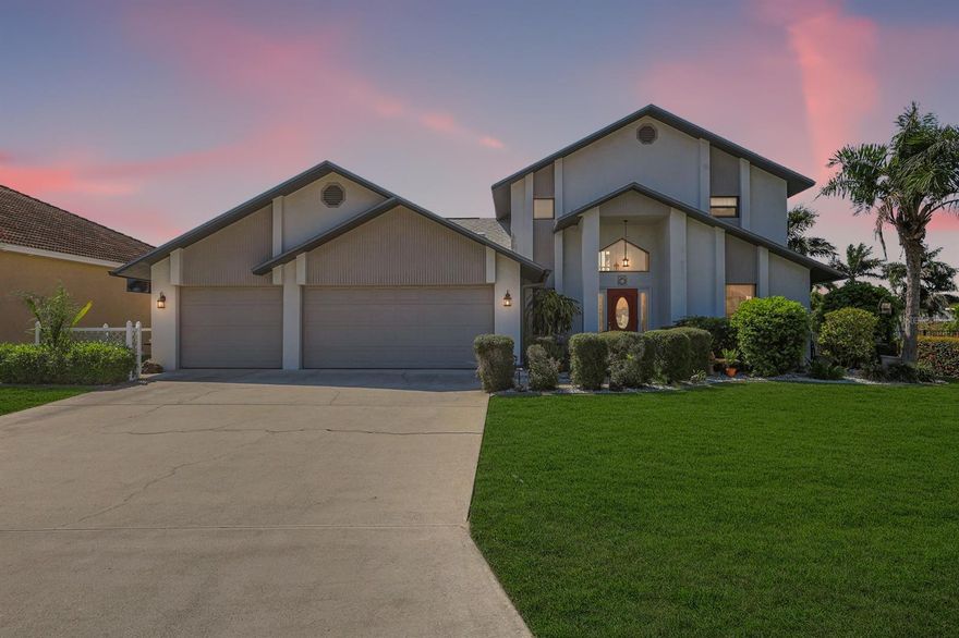 SOUTHERN EXPOSURE DIRECT GULF ACCESS POOL HOME W/ DOCK & LIFT MINUTES TO OPEN WATER! Welcome to a truly exceptional waterfront property in one of SE Cape Coral’s most desirable boating neighborhoods where every day feels like a vacation and the water is always calling. Perfectly positioned on a wide canal with quick access to open water, this home offers the ultimate Southwest Florida lifestyle with a private dock and 10,000 lb boat lift making it effortless to spend your days cruising, fishing, or enjoying breathtaking sunsets right from your backyard. From the moment you arrive, the inviting curb appeal, lush tropical landscaping, and striking entry set the tone for what’s inside. Step through the doors into a bright, open interior featuring soaring ceilings, abundant natural light, and a layout designed for both comfort and entertaining. The updated kitchen showcases quartz countertops, stainless steel appliances, and ample workspace flowing seamlessly into the main living and dining areas while multiple gathering spaces provide flexibility for everyday living and hosting guests alike. A desirable split floor plan offers privacy while the spacious upstairs retreat creates the perfect space for a primary suite, guest quarters, or private getaway. Step outside to your expansive screened lanai featuring a large covered living area, beautiful paver pool deck, and a sparkling pool surrounded by peaceful canal views. With southern exposure, enjoy sun filled days by the pool and stunning evening sunsets. The backyard is designed for the boating enthusiast complete with dock, lift, and direct Gulf access making this a rare opportunity for true waterfront living. Major updates include new impact doors and windows (2023), roof (2021), HVAC approximately 6.5 years old, water heater approximately 5 years old, updated electrical panel, irrigation system, and updated light fixtures and fans including patio fixtures and living room fans. No flooding or damage from any storms! Additional highlights include updated bathrooms, tile flooring throughout main living areas, fresh finishes, a dedicated laundry room, and a well maintained move in ready feel. Homes with this combination of exposure, access, and lifestyle don’t last—enjoy peaceful mornings or sunset views from your private screened second floor balcony and take advantage of this rare opportunity.