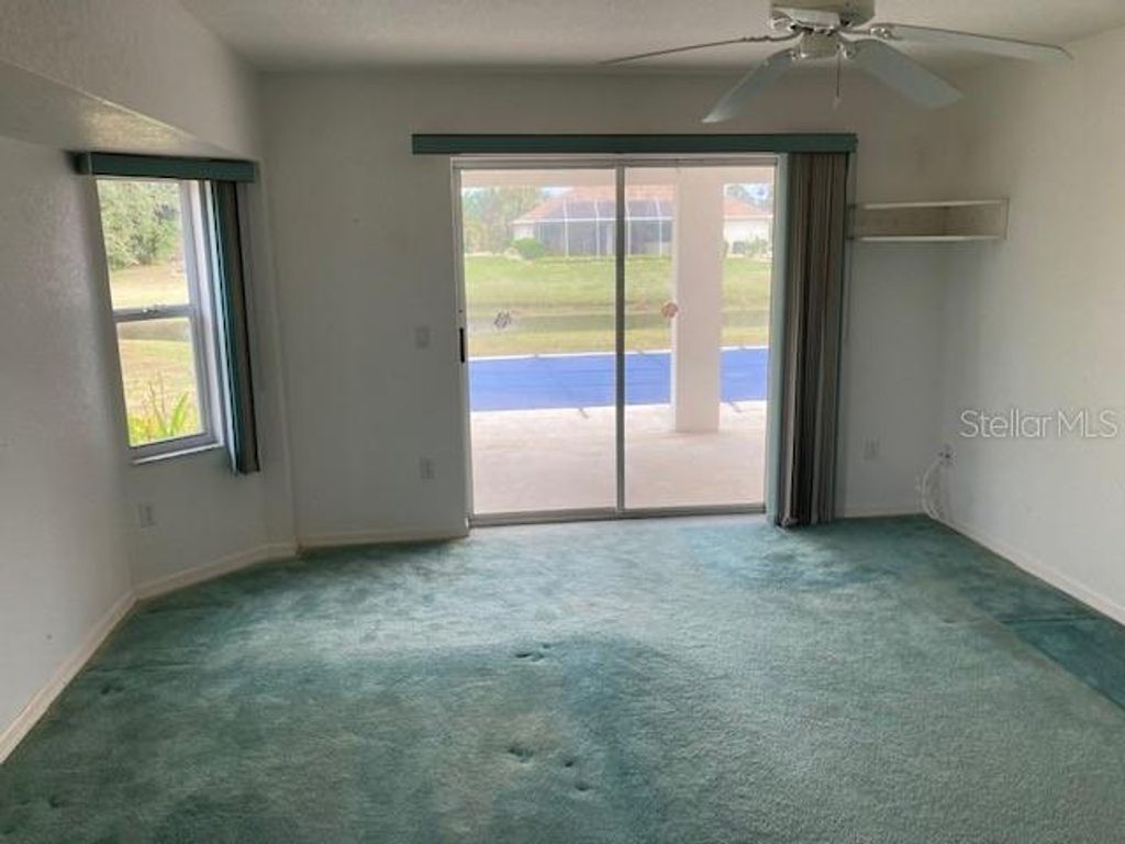 Photo of 136 Long Meadow Lane, Rotonda West, FL 33947 (MLS # O6366276)