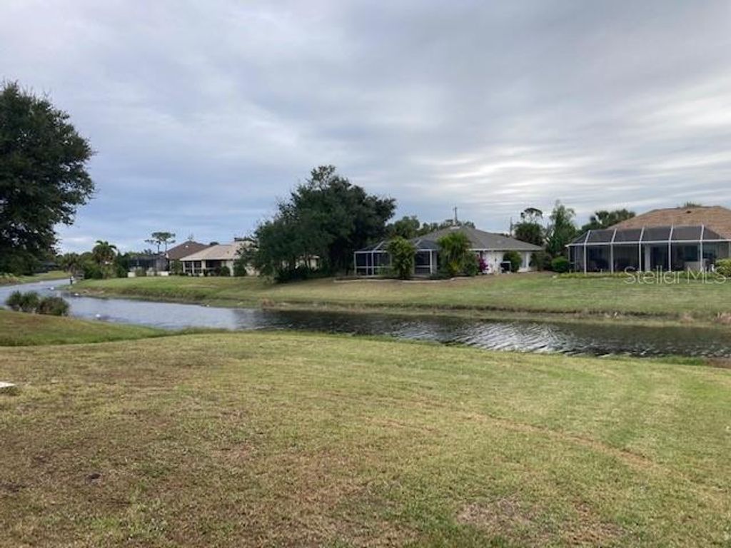 Photo of 136 Long Meadow Lane, Rotonda West, FL 33947 (MLS # O6366276)