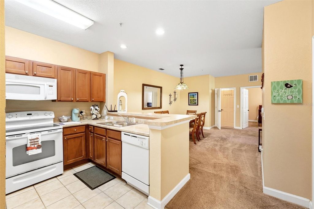 Photo of 3176 Feltrim Place #102, Kissimmee, FL 34747 (MLS # O6351121)
