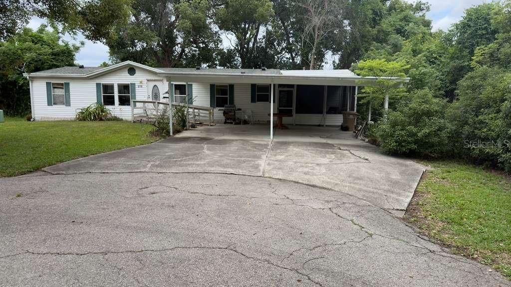 Photo of 2011 Pinewood Lane, Mount Dora, FL 32757 (MLS # O6409316)
