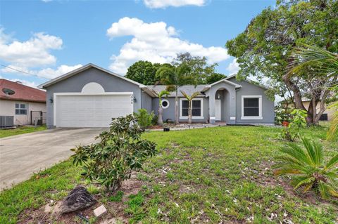Photo of 3936 SW Jarmer Road, Port Saint Lucie, FL 34953 (MLS # O6396826)