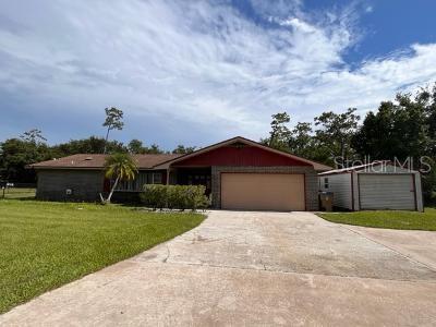 This well maintained home sits on a full acre in the established neighborhood. It is a 3 bedroom 2 bath ranch home with a bonus room that can be used as an office or bedroom. The 1780 sqft. Home is block with brick exterior. As you walk in the front door you have a family room off to the left with access to the kitchen. The master is on the left for privacy and has a walk-in closet and the master bath has dual sinks and vanity with raised ceiling. The living room has a beautiful brick fireplace and double doors that lead to the screened in 32x15 f. Solar heated pool and large covered lanai. The house has skylights to add to the natural lighting inside and the roof over the lanai was just replaced in 2018. All the homes in the neighborhood have large lots and plenty of elbow room which is hard to find these days. The 65 gallon water heater is only 6 years old and can be controlled by your smartphone. The home is wired for an ADT security system on all doors and windows. As well as a professionally installed RING doorbell. There is a beautiful crystal chandelier in the dining room and skylights in the main bath. Outside there is a 24x12 metal garage to store tools or toys. The Neighborhood has no HOA or COD. It is on a septic and well system so no water bill either. Homes this well built and cared for with an acre of land and pool are hard to find. Come see this one before it's gone. Seller is very motivated!