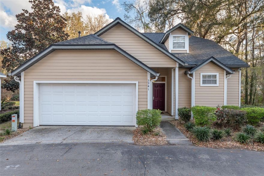 Rare opportunity in this 10 home gated community conveniently located near park, elementary school, shopping, restaurants and UF.  The home backs up to a creek with a deck overlooking a wooded area where deer are often seen.  The main floor includes all the features for daily life--lovely kitchen with stone counters and a breakfast bar, the dining/living room combination with gas fireplace, opening to the deck, the primary bedroom suite, laundry room and half bath.  Upstairs are two additional bedrooms and a bath.  There are separate heating and cooling units for each level.  Appliances, washer and dryer are included and a number of furniture items can be included as part of a purchase.  Especially low HOA fees for a gated community!  Copies of upgrades and community documents are available.  Easy to see so plan a visit today!