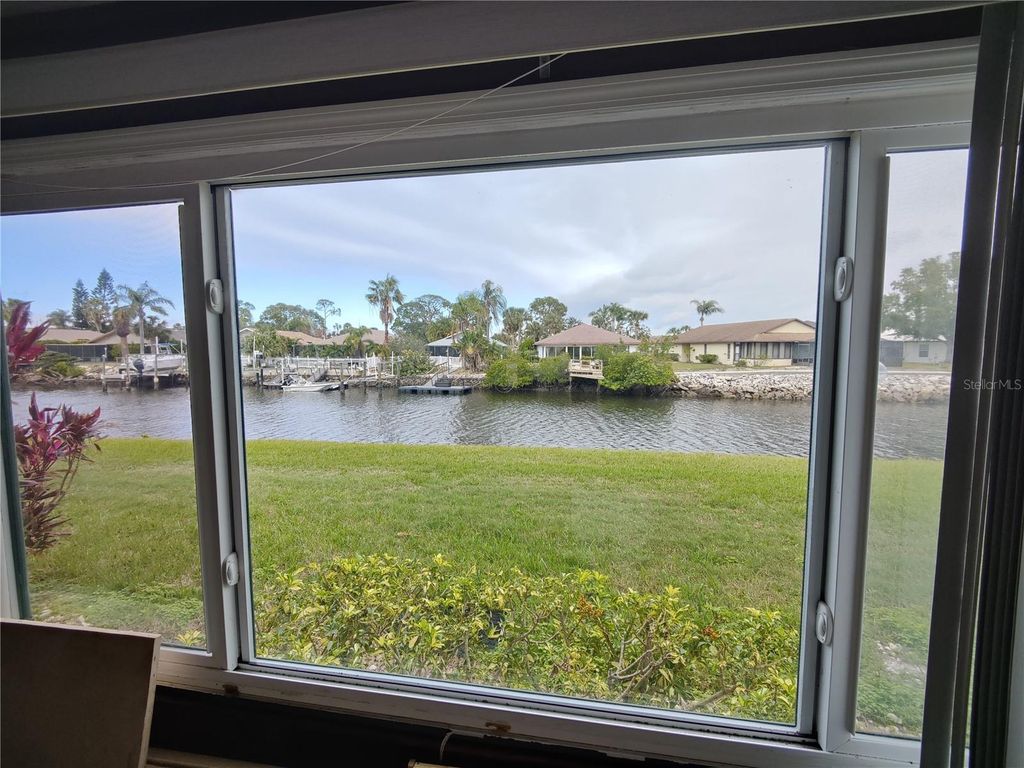 Photo of 4555 Marine Parkway #102, New Port Richey, FL 34652 (MLS # W7870896)
