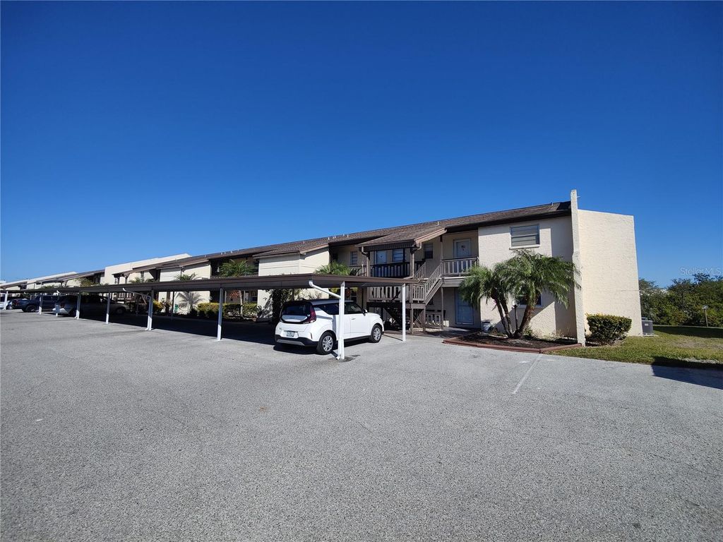 Photo of 4555 Marine Parkway #102, New Port Richey, FL 34652 (MLS # W7870896)