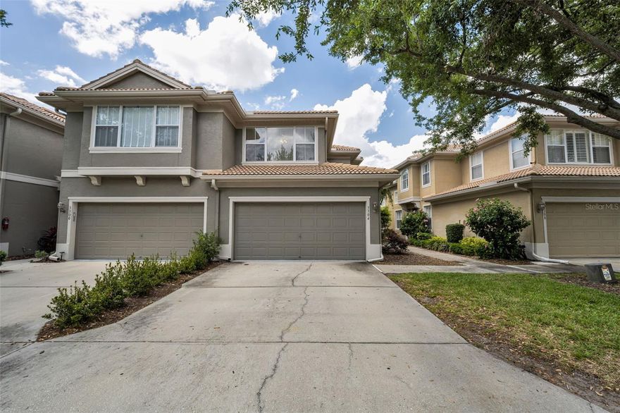 Welcome to this like-new construction, beautifully maintained END UNIT, Townhome offering the perfect blend of style, space, and location! This spacious residence features 3 bedrooms, 2.5 bathrooms, and a desirable 2-car garage.  The primary suite is conveniently located on the first floor, offering privacy and comfort. The ensuite bath features dual vanities, a relaxing soaking tub, a separate shower, and a private water closet, along with a spacious walk-in closet.  The main living area boasts an open and airy floor plan with high ceilings and lots of natural light, a kitchen with an eat-in dinette and breakfast bar—perfect for both everyday living and entertaining. You’ll also appreciate the convenience of an inside laundry with washer and dryer.  Upstairs, you’ll find two additional bedrooms, and full bath and a huge bonus room that provides endless possibilities—ideal for a media room, home office, or playroom.  Step outside to the covered and enclosed lanai, creating the perfect space to relax and enjoy Florida living year-round.  Ideally located just minutes from shopping, dining, and the beautiful shores of Honeymoon Island State Park, known as a world-famous beaches year after year. This home offers a fantastic central location with easy access to everything you need.  Don’t miss your chance to own this move-in ready gem!