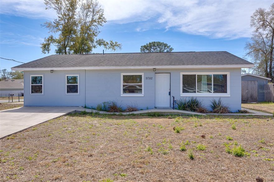 This cute 3/1 home has been completely updated: Roof - 2018, HVAC-2021, Water Pump/Tank -2020,
Windows-2021. This home sits on a large corner lot, completely fenced with a storage shed, dog kennel, and
a large dog run in the backyard. Did I mention location? Great location close to The Villages, Belleview,  and
less than one mile to Lake Weir. Call today and schedule your personal showing.