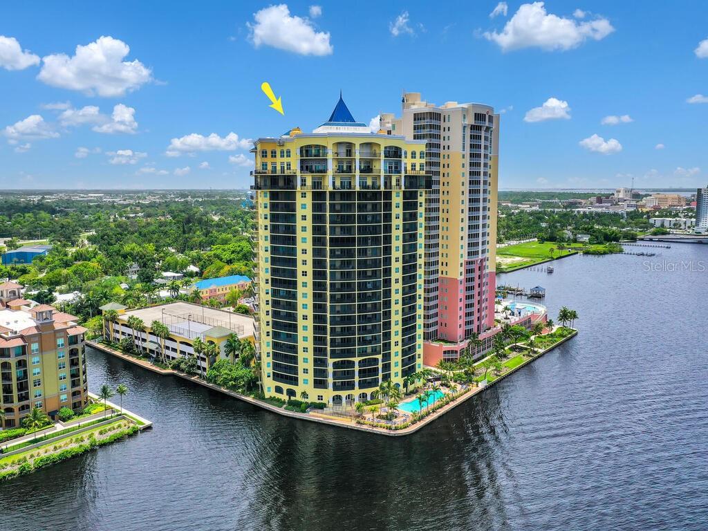 Tucked away in the heart of Downtown Fort Myers, this immaculate condo unit at Beau Rivage offers a truly remarkable living experience. Spanning over 1,300 square feet, the three-bedroom, two-bathroom layout provides ample space for comfortable living, while the stunning views of the Caloosahatchee River create a serene and picturesque backdrop. Step onto your oversized balcony and immerse yourself in the tranquil ambiance, watching boaters glide by and spotting the occasional wildlife. The interior boasts beautiful French Pattern Travertine floors in the main areas and bathrooms, complemented by hand-scraped wood floors in the bedrooms, adding warmth and elegance to every step. Convenience and luxury blend seamlessly in this exceptional residence. With two covered parking spaces and additional storage located right outside the unit, you'll enjoy hassle-free condo living. Beau Rivage offers an array of first-class amenities, including a concierge service, fitness center, tennis courts, a computer/card room with Wi-Fi and printer access, a billiard's room, a theater, a sauna, and a refreshing pool and hot tub area. Situated in the heart of Downtown Fort Myers, this condo affords you the luxury of walking to an array of restaurants, shops, and the convenient trolley service, allowing you to fully embrace the vibrant local culture. Discover the perfect balance of sophisticated living and urban convenience in this truly remarkable condo unit.